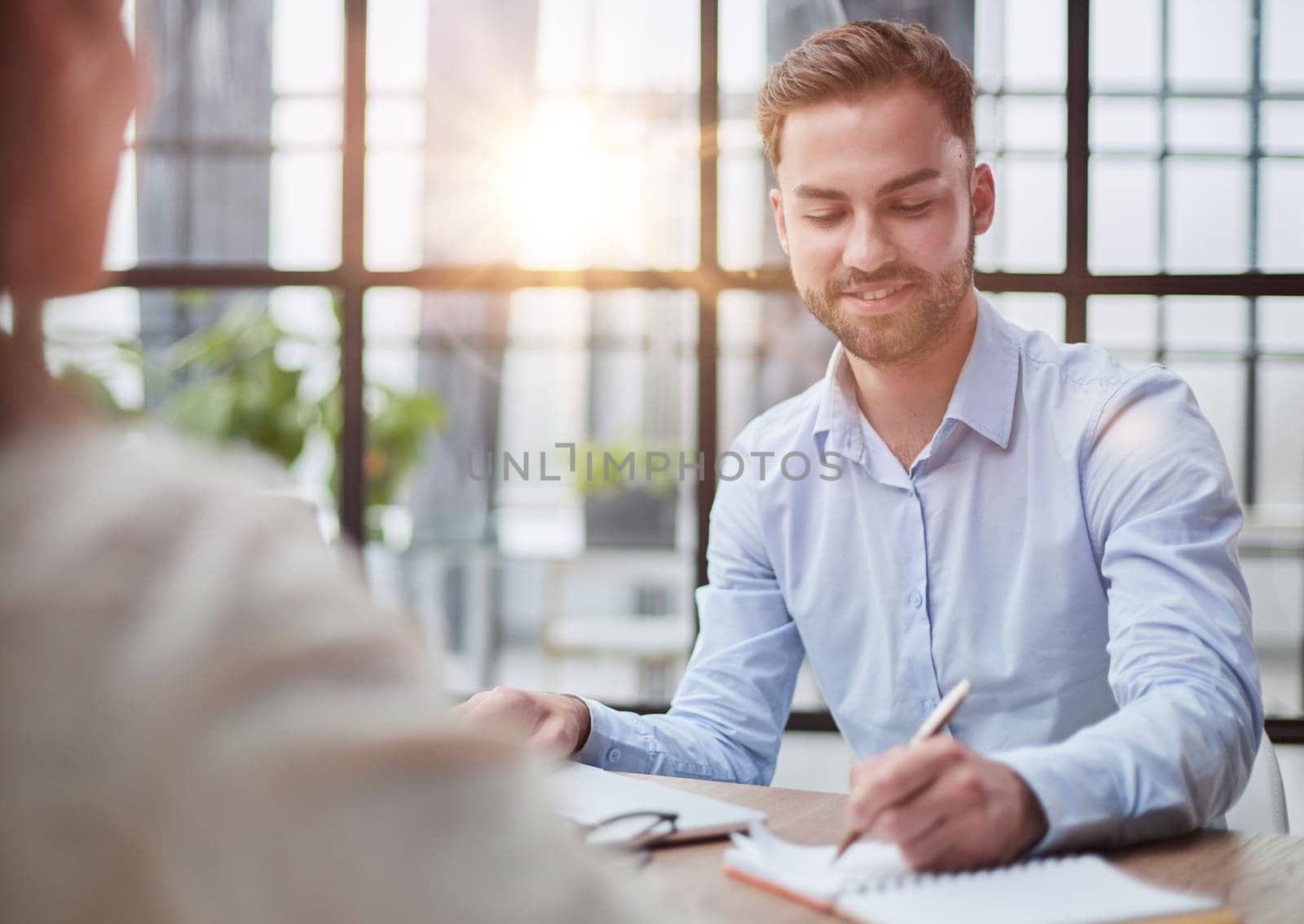 Handsome bearded man in a modern office