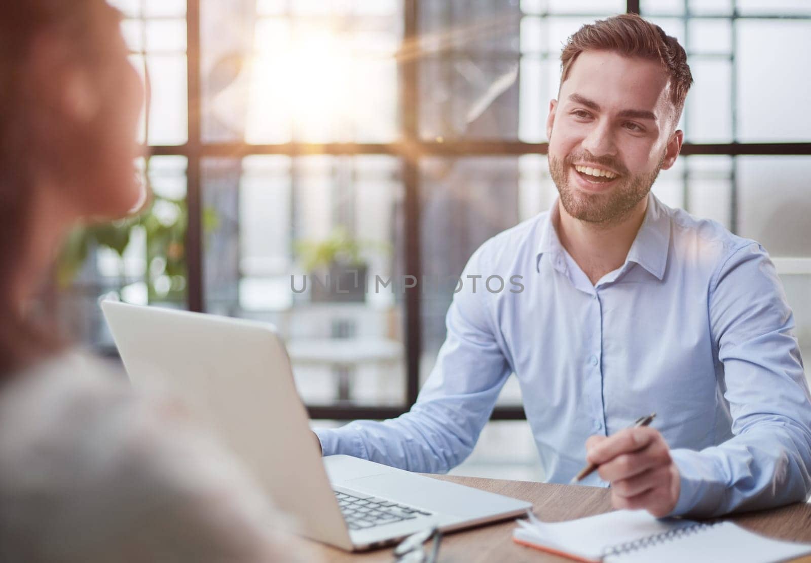 Handsome bearded man in a modern office