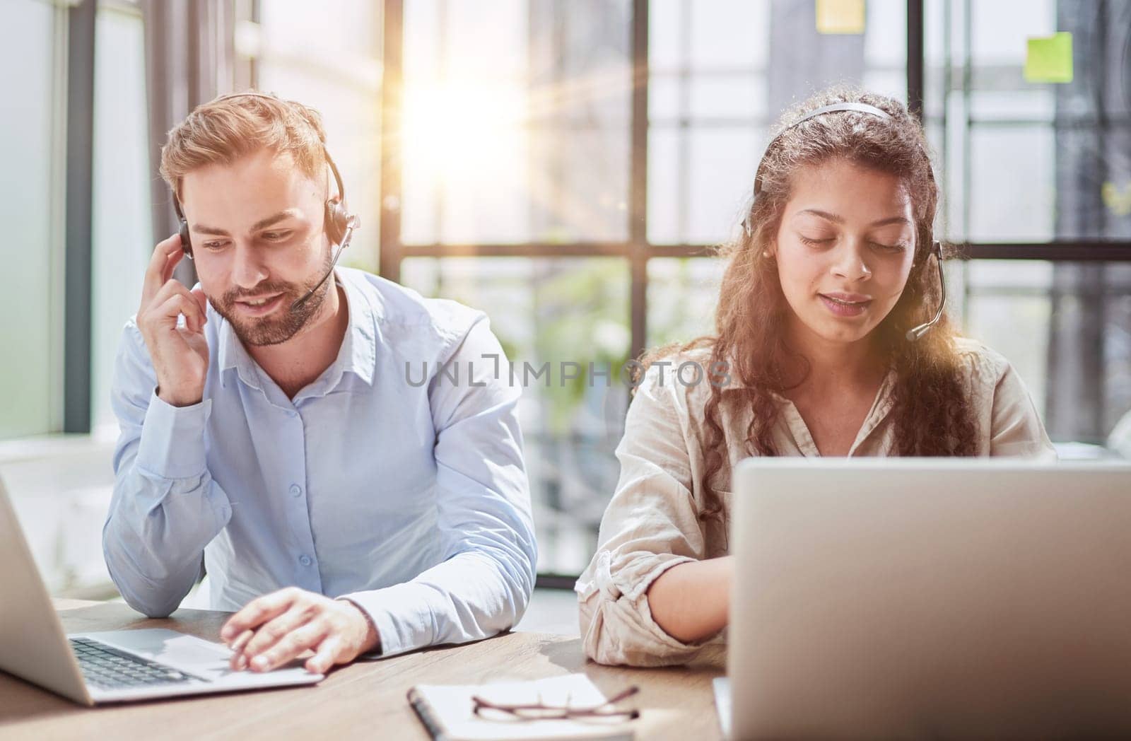 Happy young man and woman , using laptop together