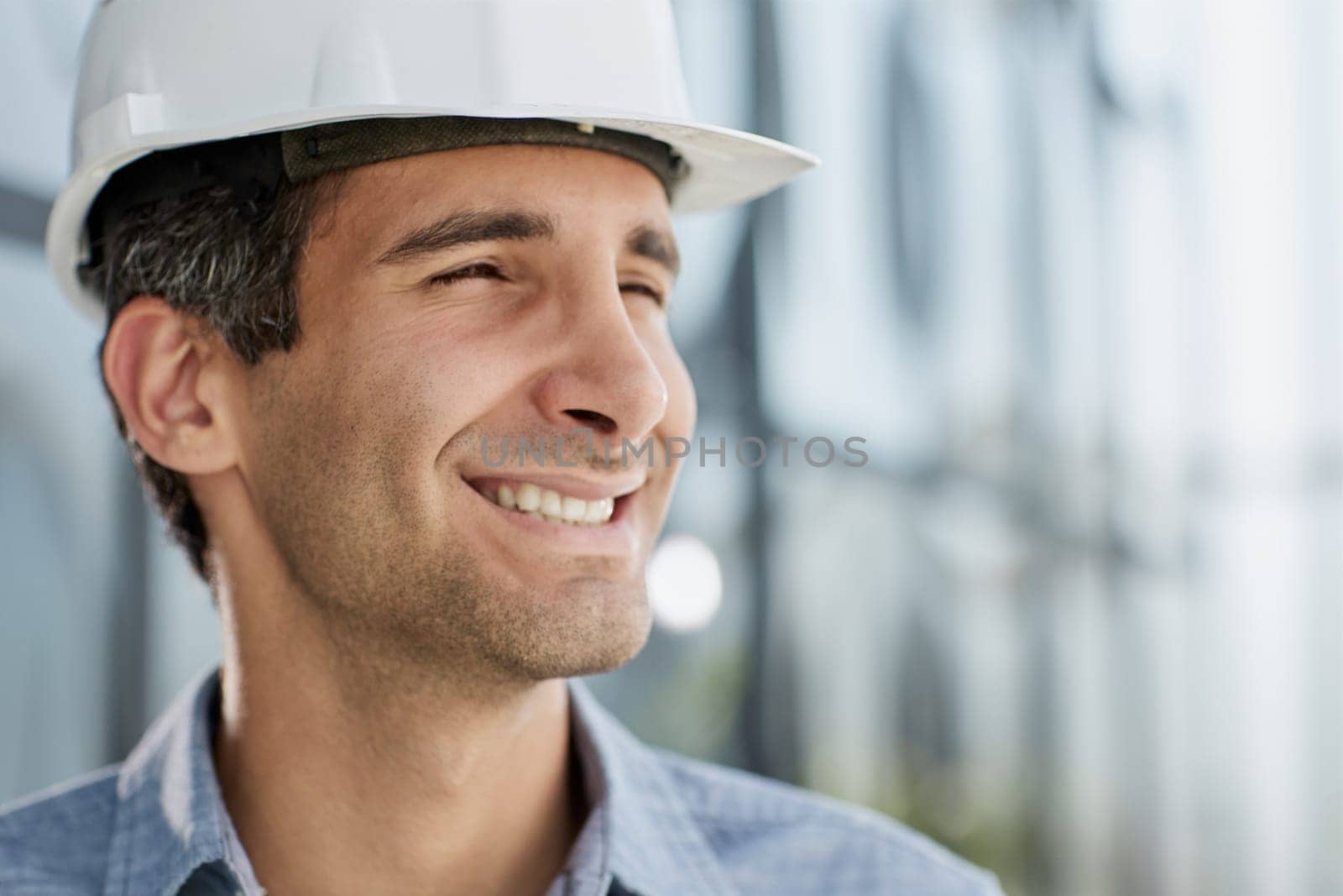 portrait of a confident businessman in a protective helmet