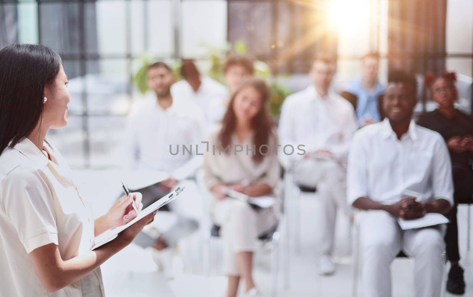 Business people attending a seminar with social distancing
