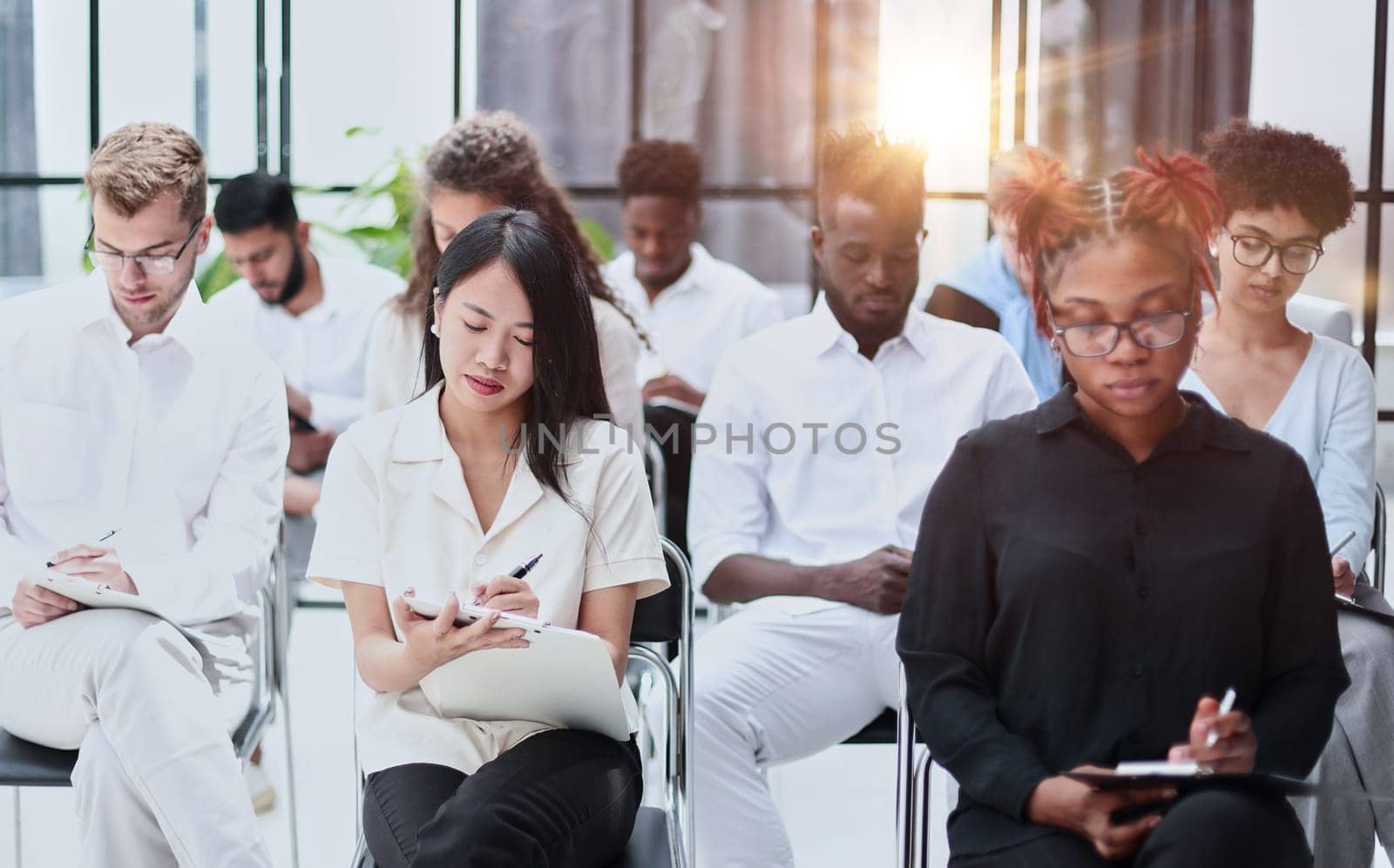 Business executive delivering a presentation to his colleagues during meeting or in-house workshop.