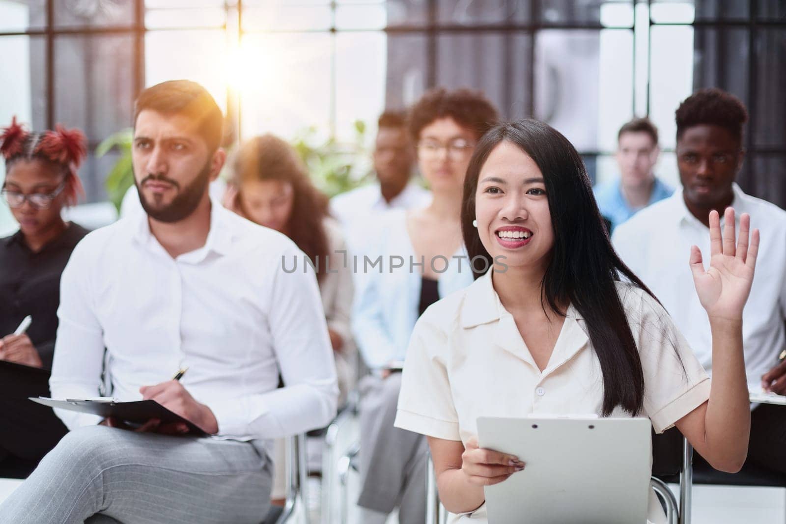 conducts business training with a group of young people.
