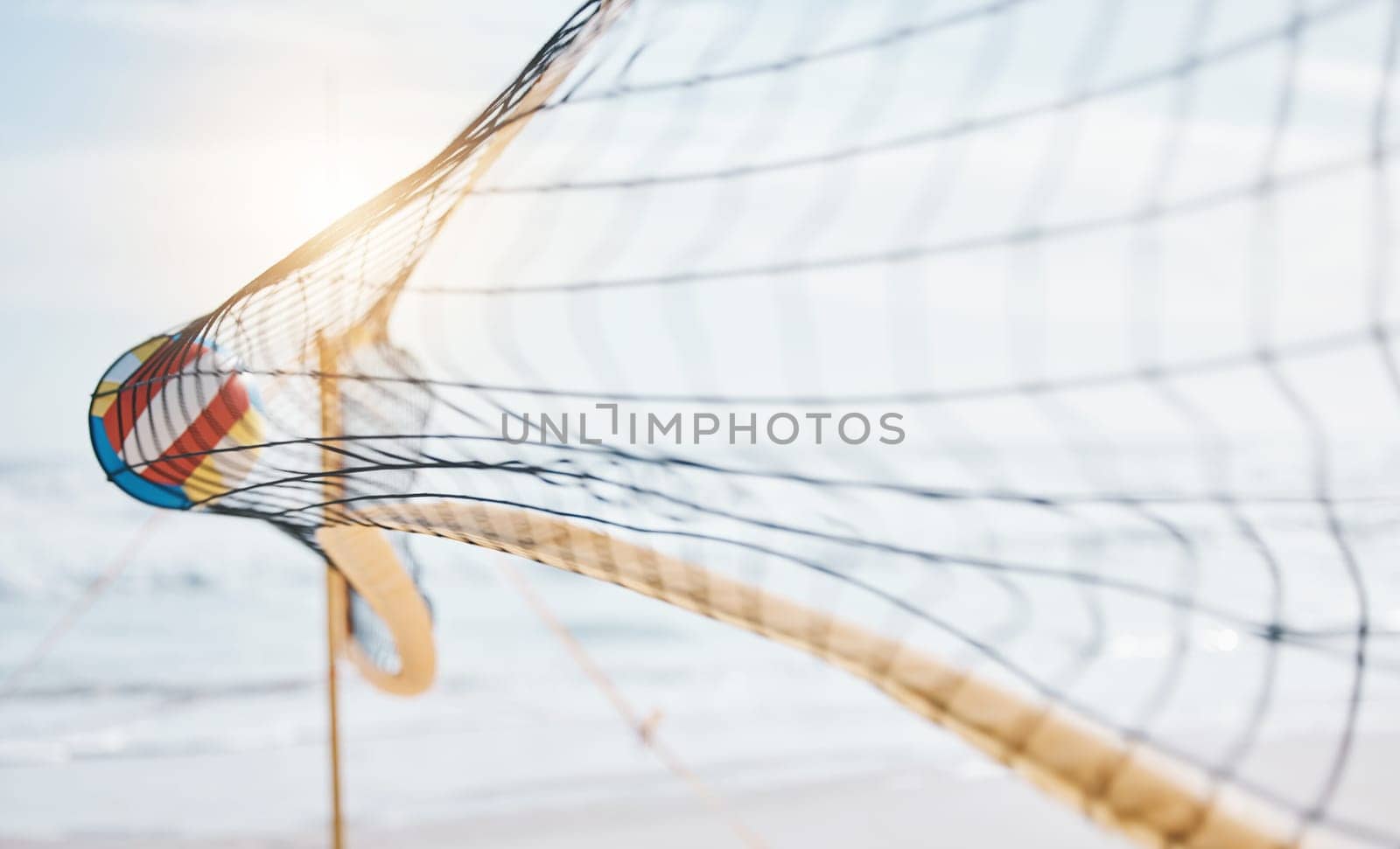 Volleyball, net and speed at beach sports for fitness, exercise or training in summer. Holiday, sun and equipment for game or competition by the ocean in the morning for cardio or a game for vacation.