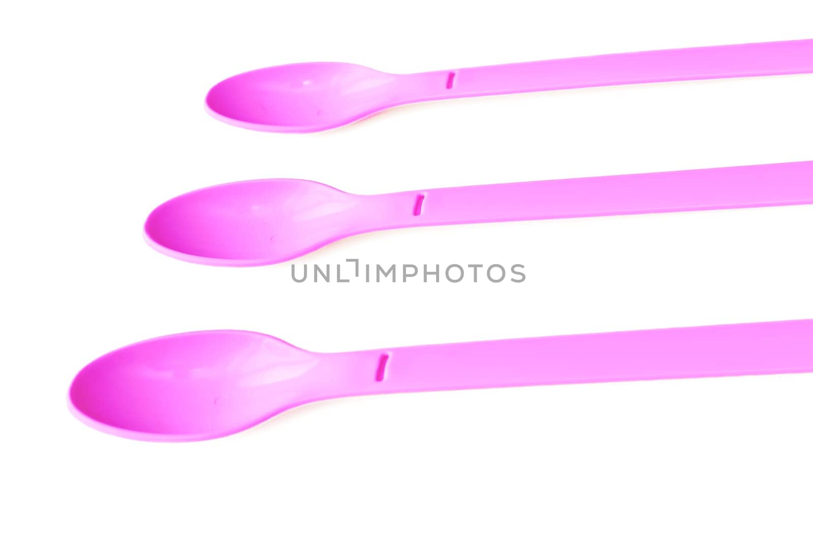 Pink plastic spoons for camping, isolated on white surface by jovani68