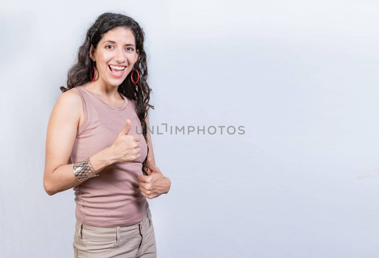 Happy smiling woman with thumbs up doing ok. Happy girl with thumbs up on isolated background, Smiling woman showing ok gesture isolated