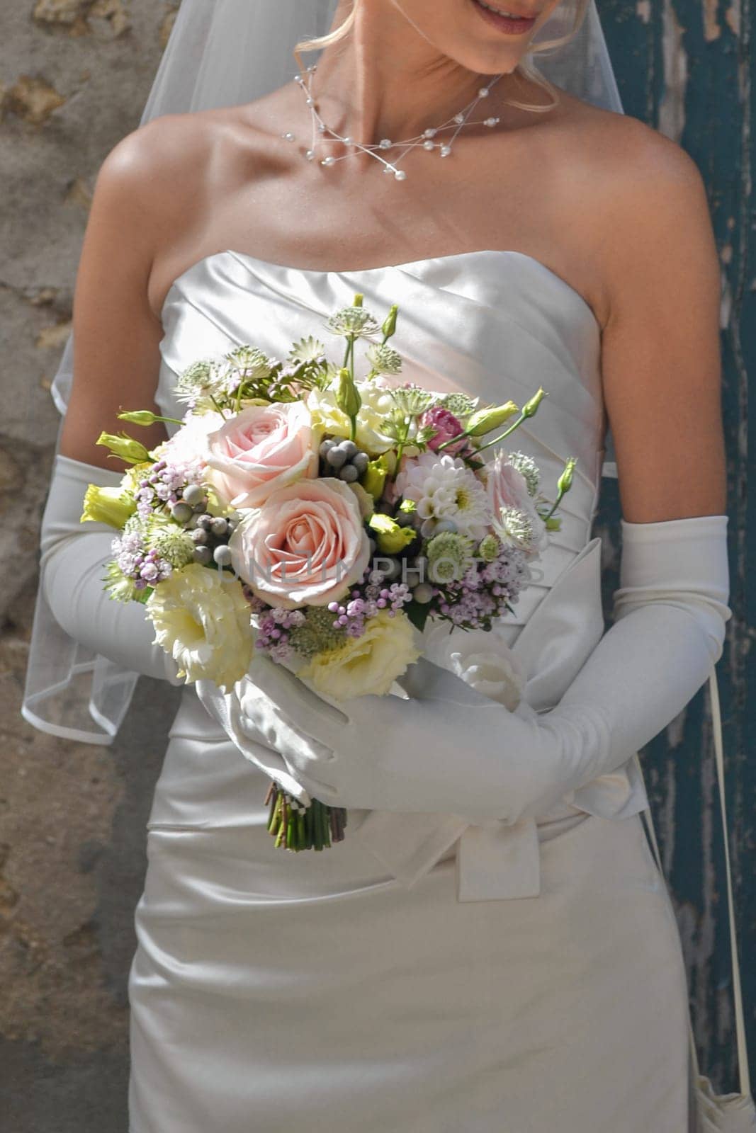 Wedding bouquet in hands of the bride