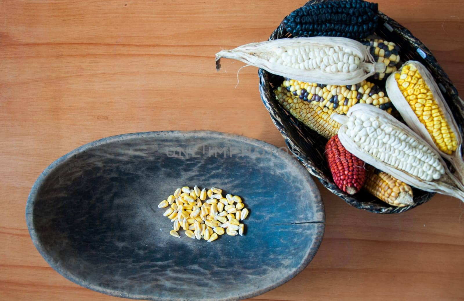 Plated in wooden bowls on a table of the different types of corn that exist in Ecuador. High quality photo