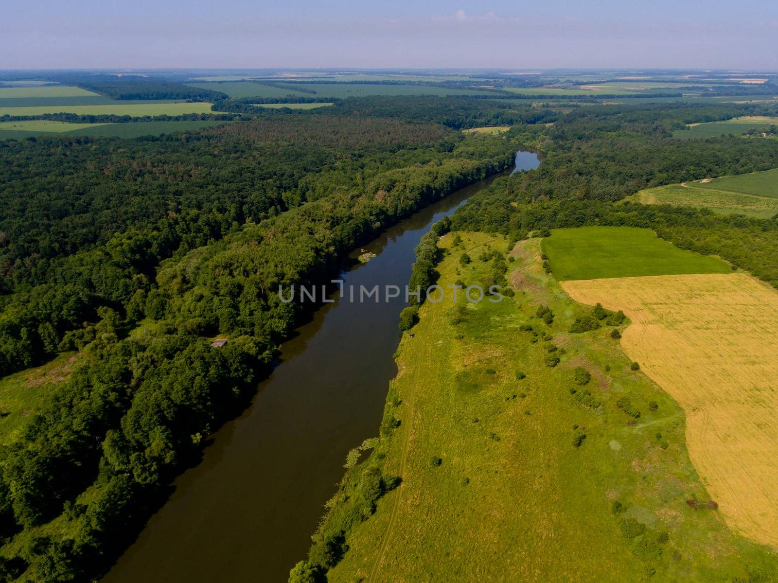 Aerial view of fields, forest, river, a beautiful landscape of nature. by leonik