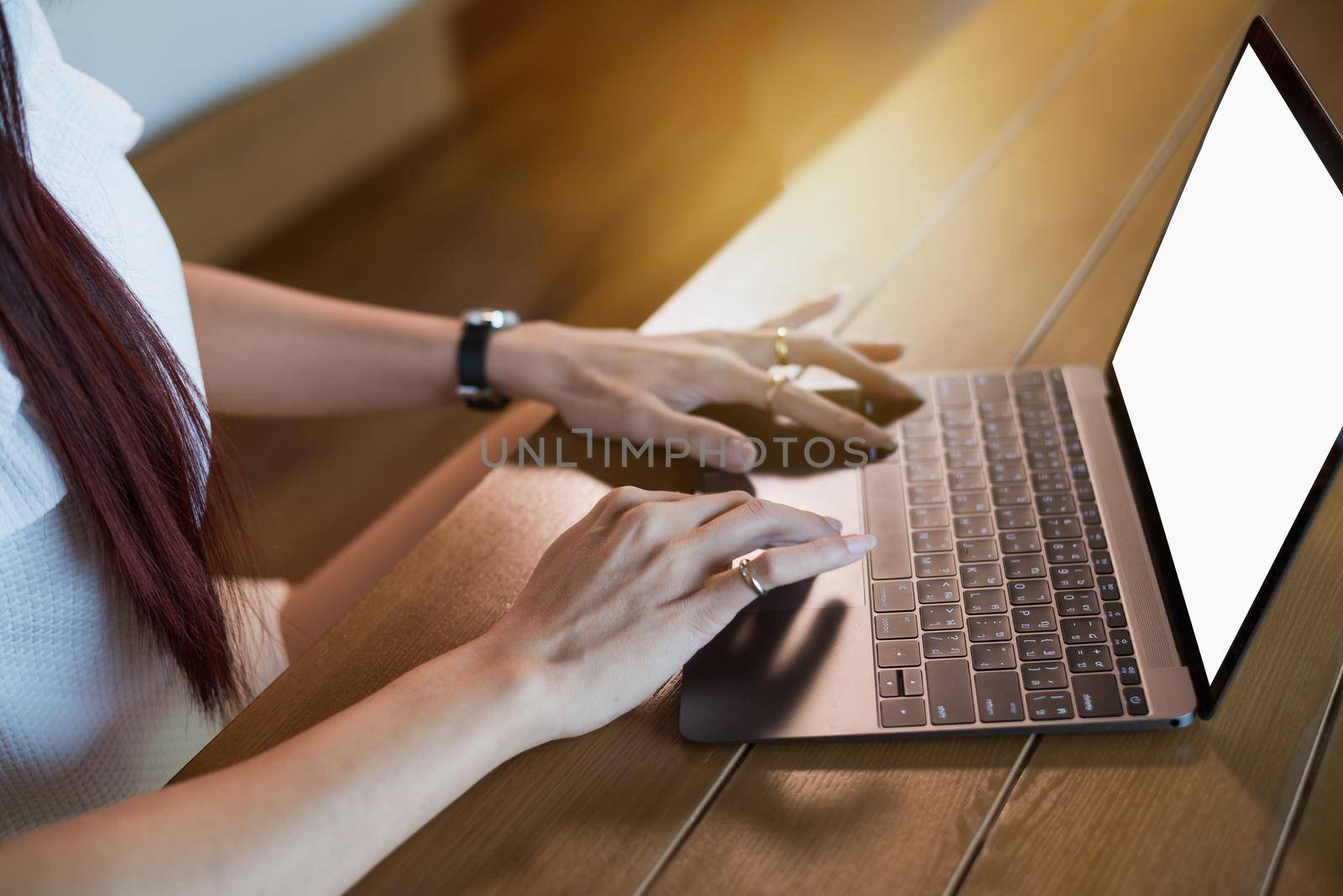 Woman working at home office hand on keyboard close up