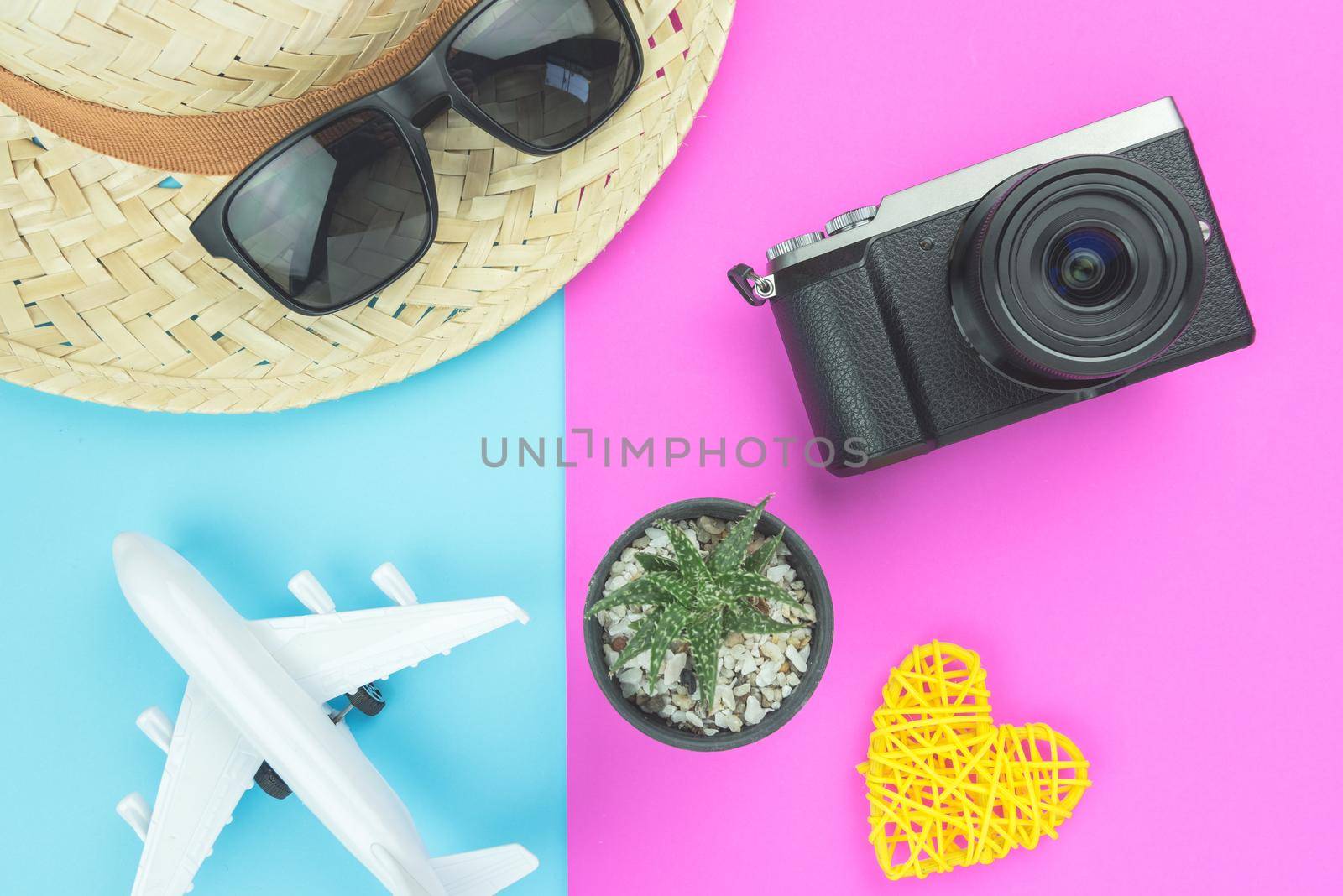 Creative Flat lay fashion style with travel concept colorful background by Wmpix