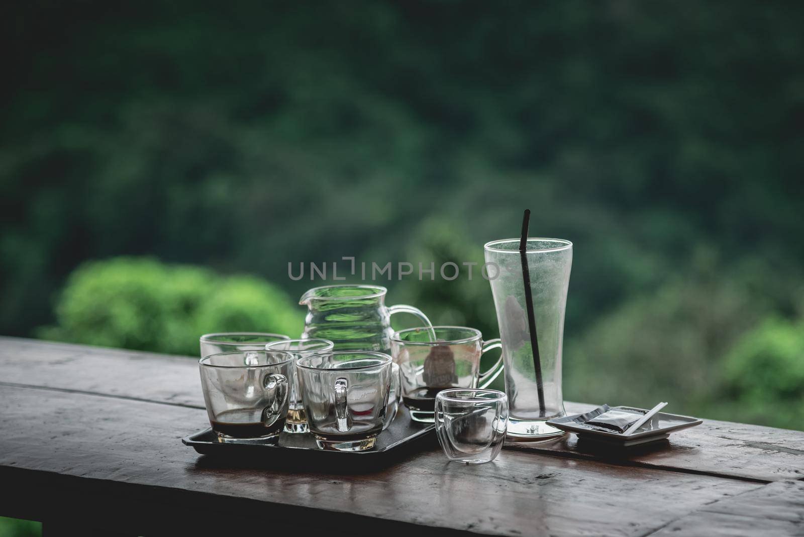 cup of coffee dirty on wood table by Wmpix