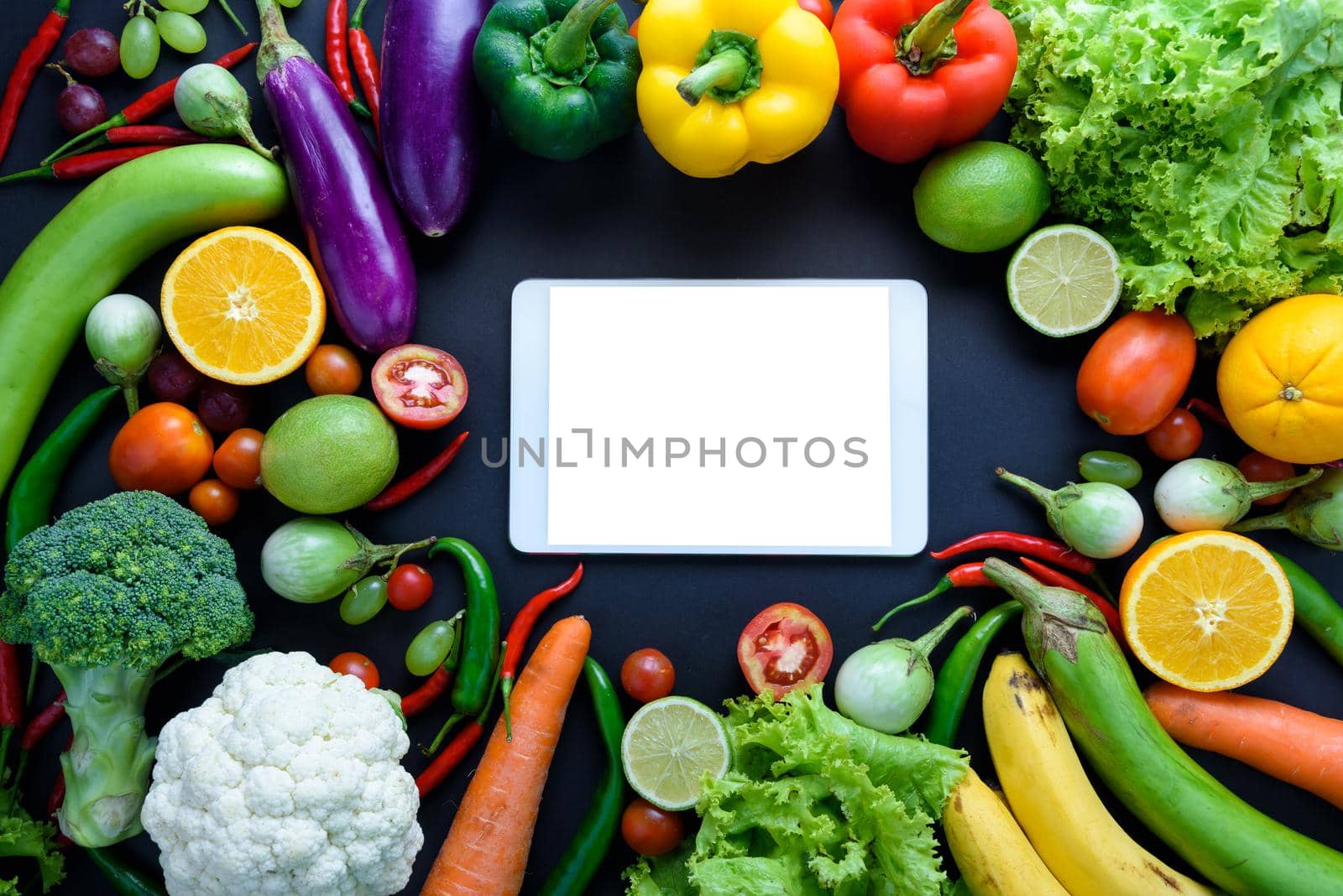 Healthy food concept of fresh organic vegetables and wooden desk background. Ingredients top view by Wmpix