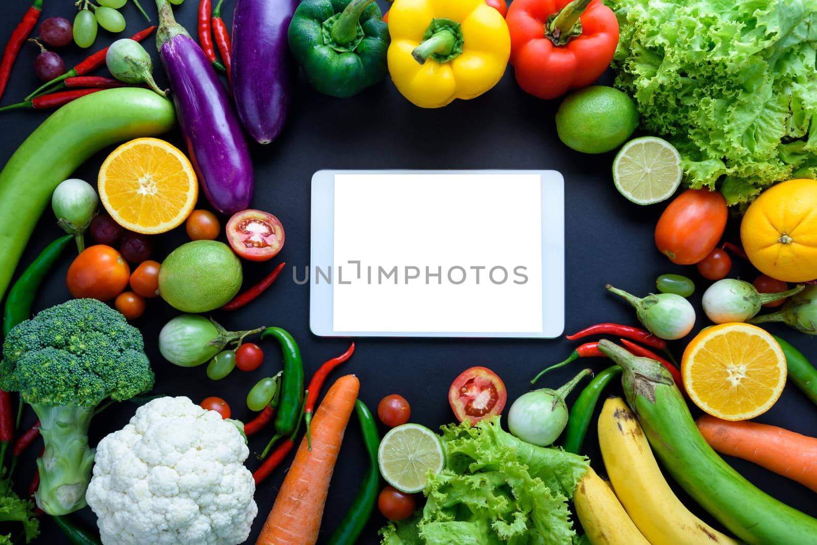 Healthy food concept of fresh organic vegetables and wooden desk background. Ingredients top view