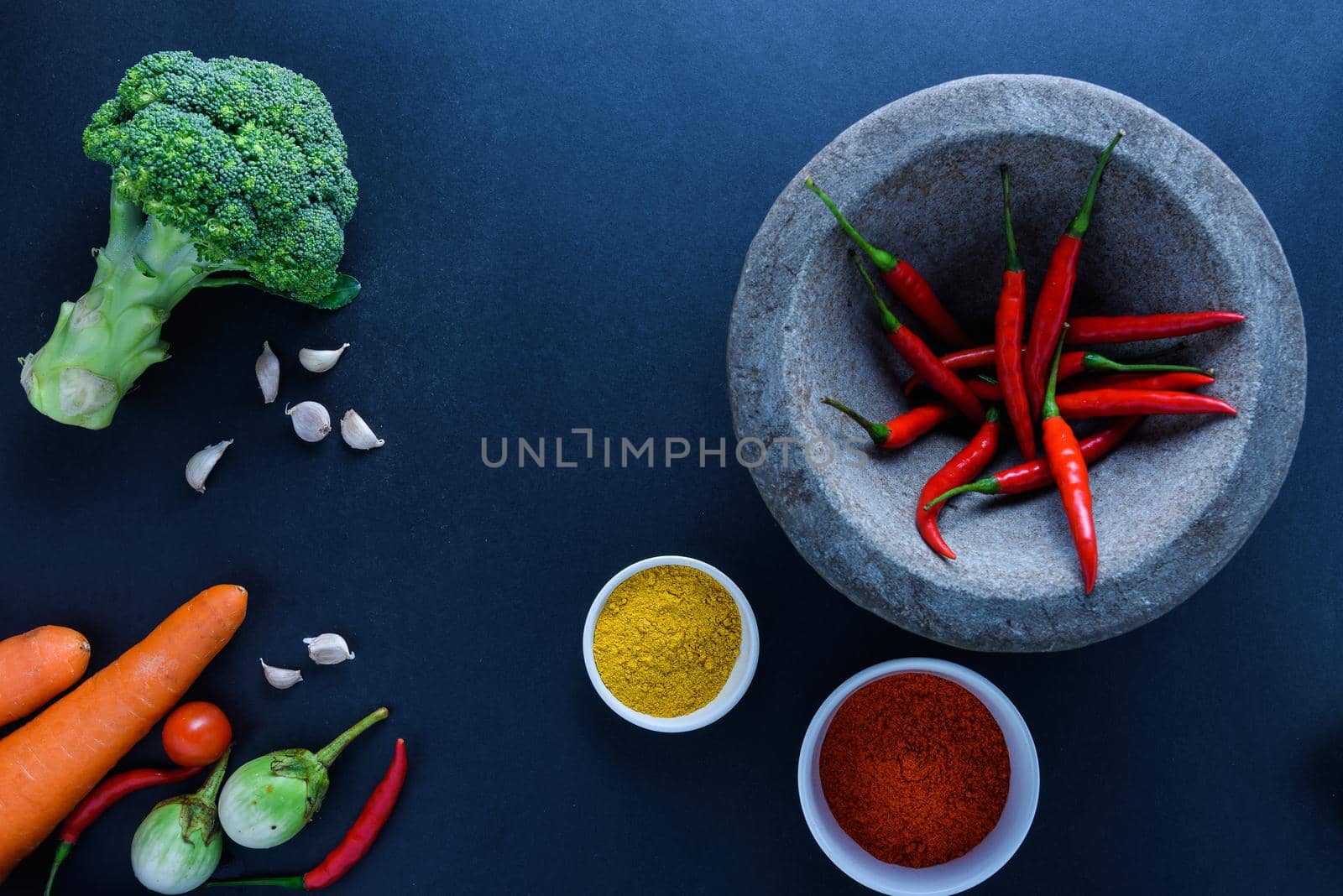Healthy food concept of fresh organic vegetables and wooden desk background. Ingredients top view by Wmpix