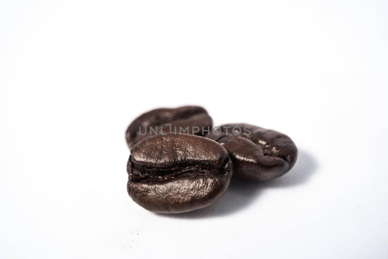 roasted coffee beans isolated in white background cutout by Wmpix