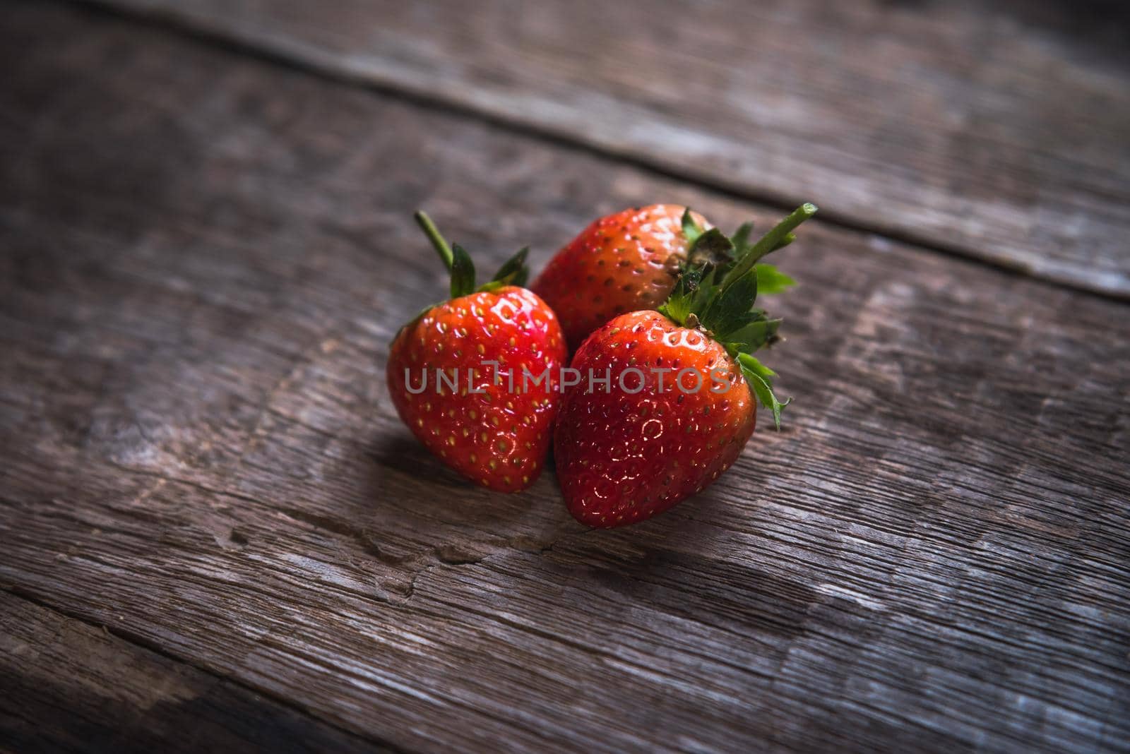 Fresh strawberry on wooden background. Top view, flat lay