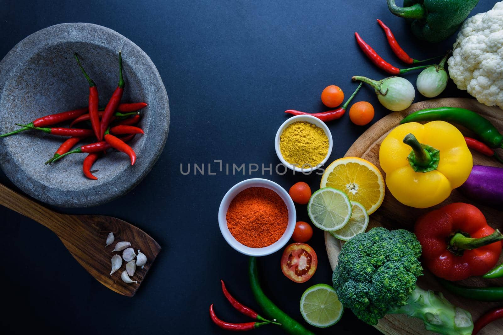 Healthy food concept of fresh organic vegetables and wooden desk background. Ingredients top view by Wmpix