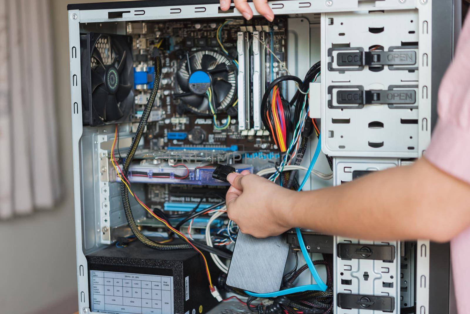 Young woman repairing computer