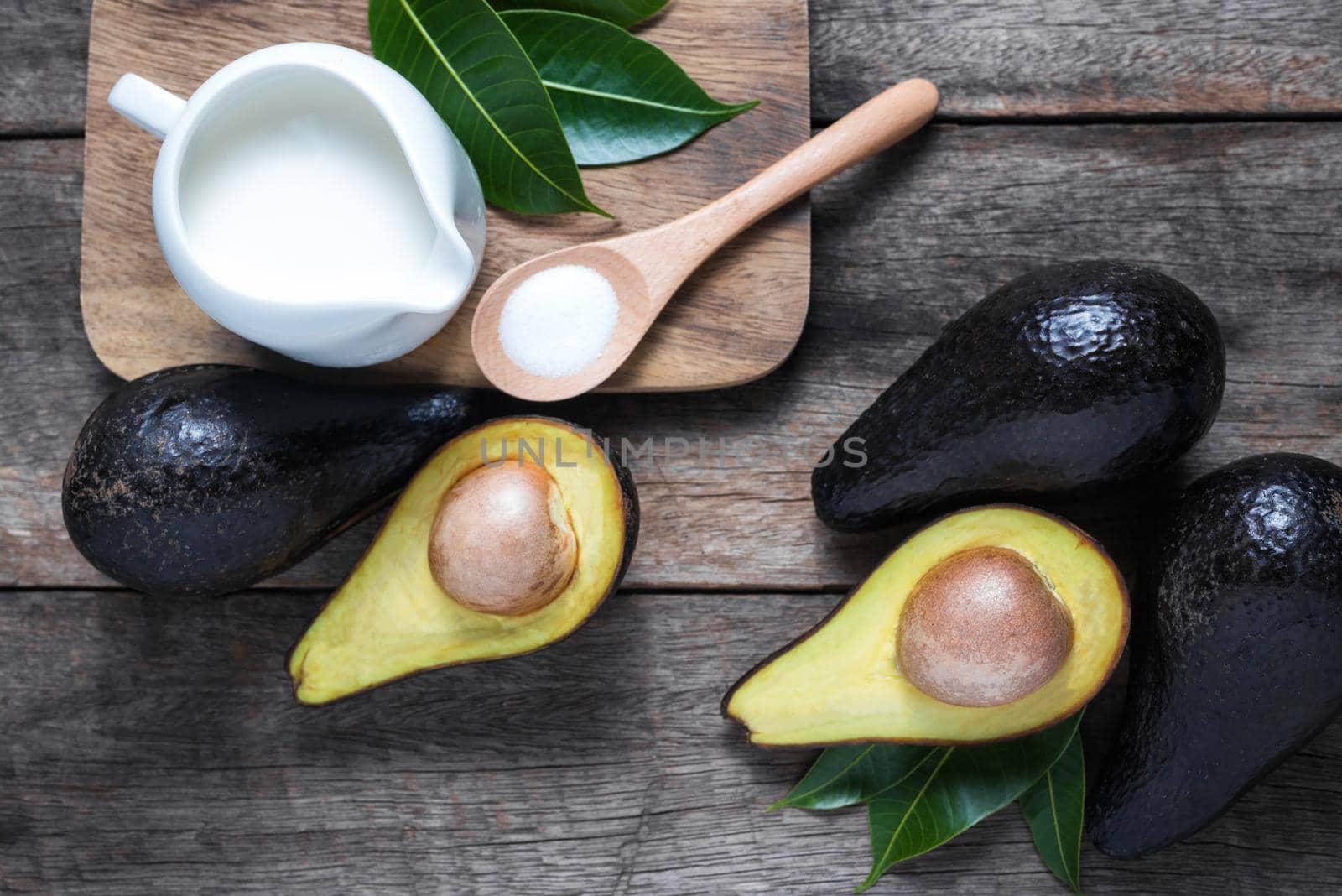 fresh organic avocado on old wooden table by Wmpix