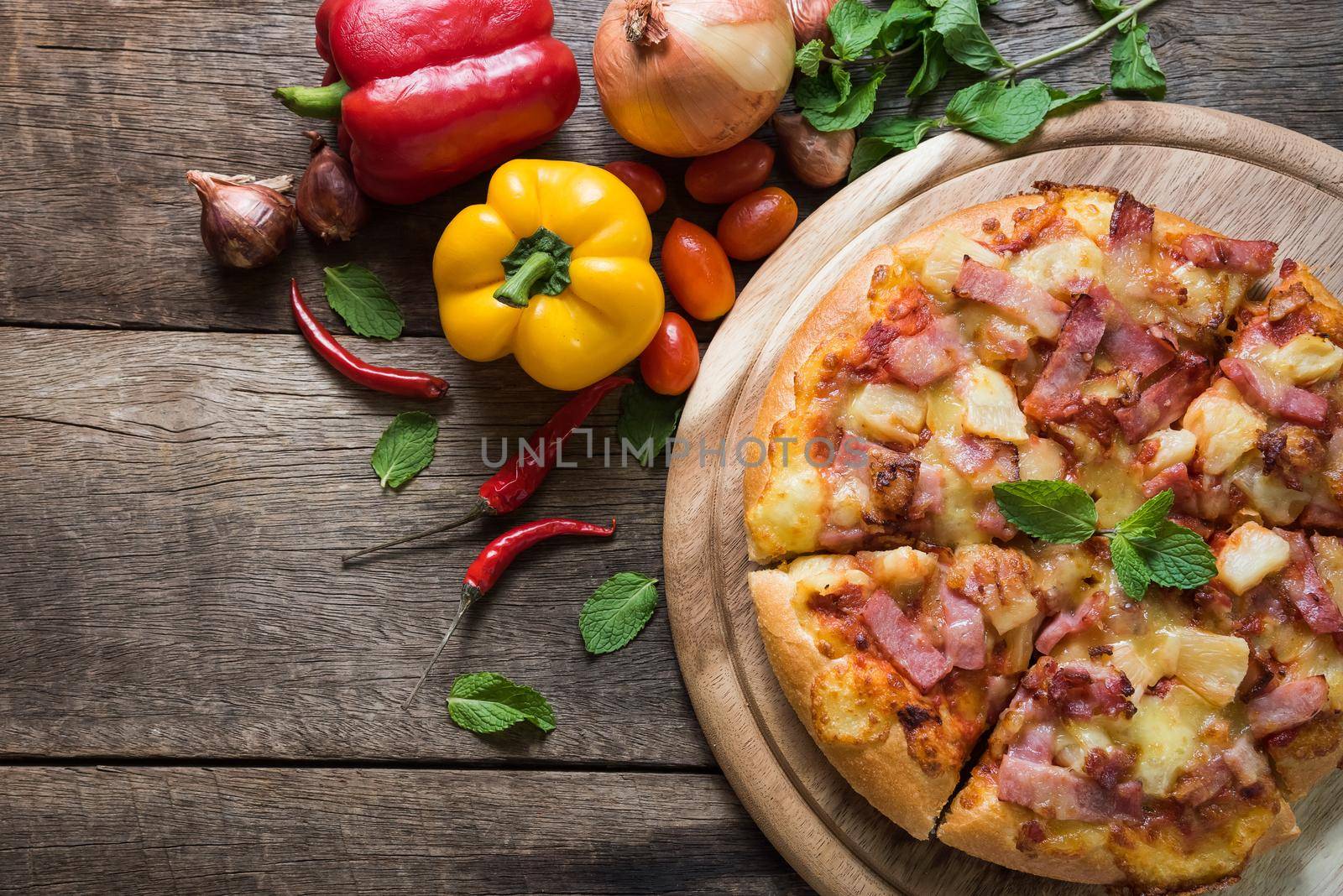 Delicious italian pizza on wooden table. Top view by Wmpix