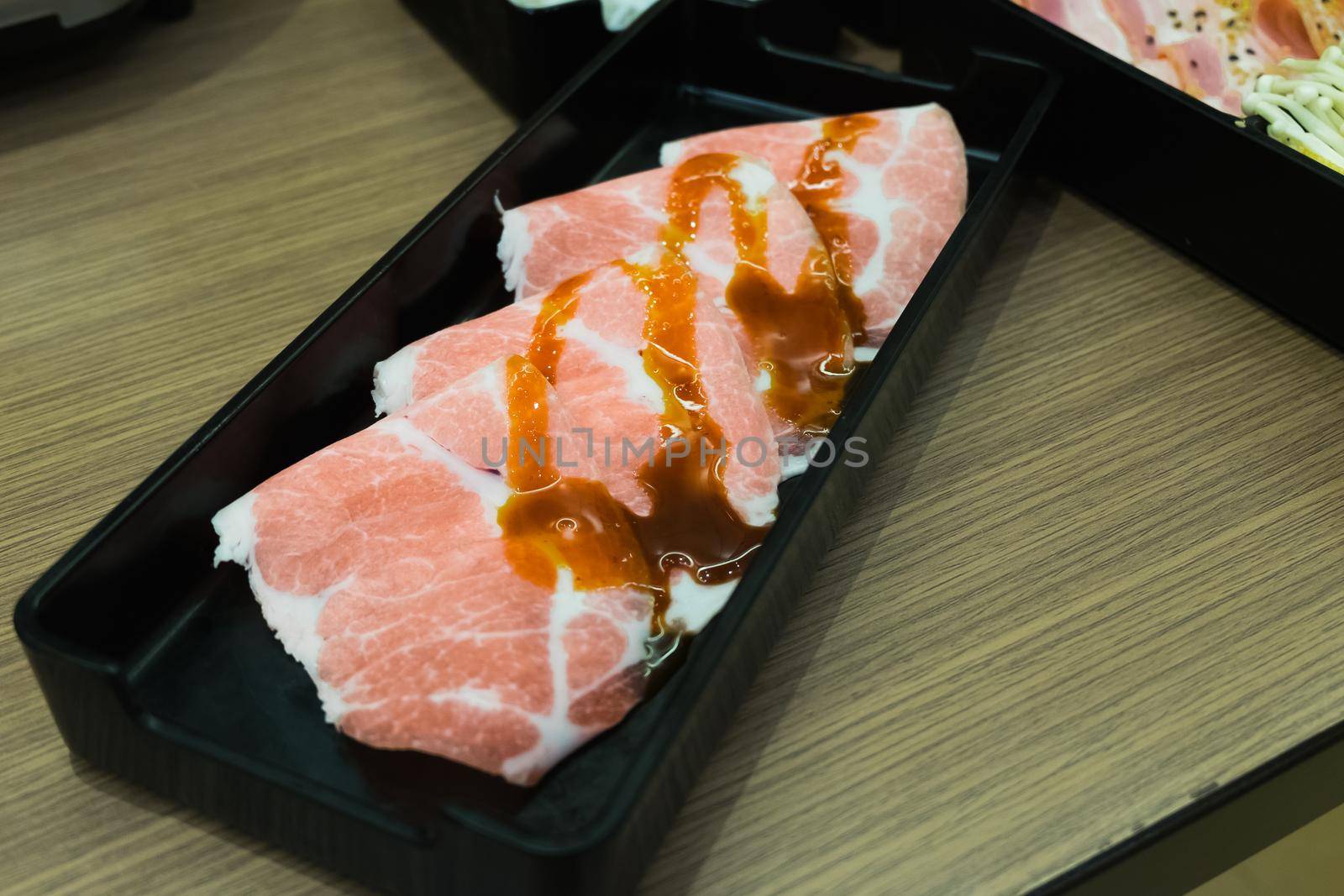 Raw beef slice for barbecue or Japanese style yakiniku by Wmpix