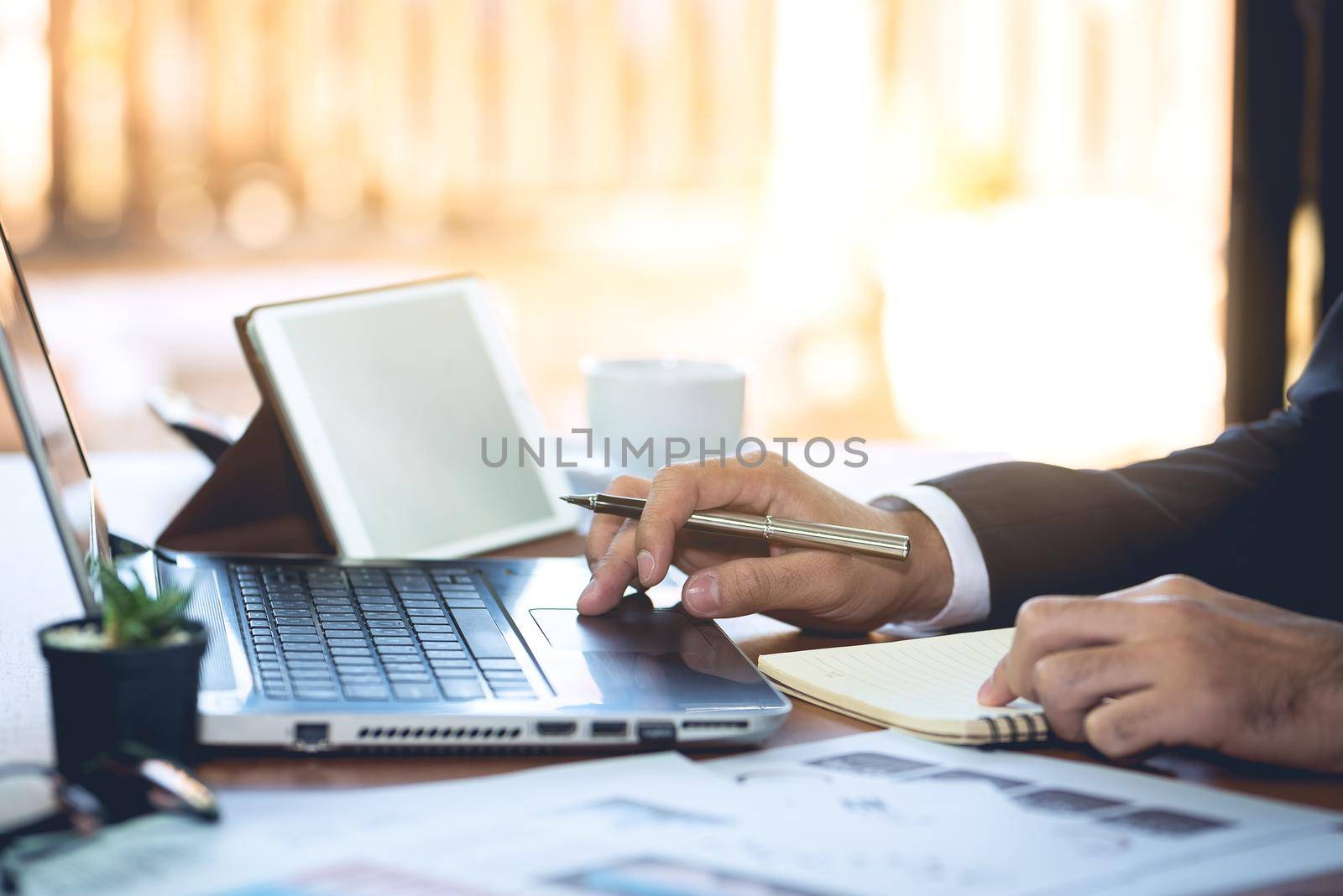 Businessman working on Desk office business by Wmpix