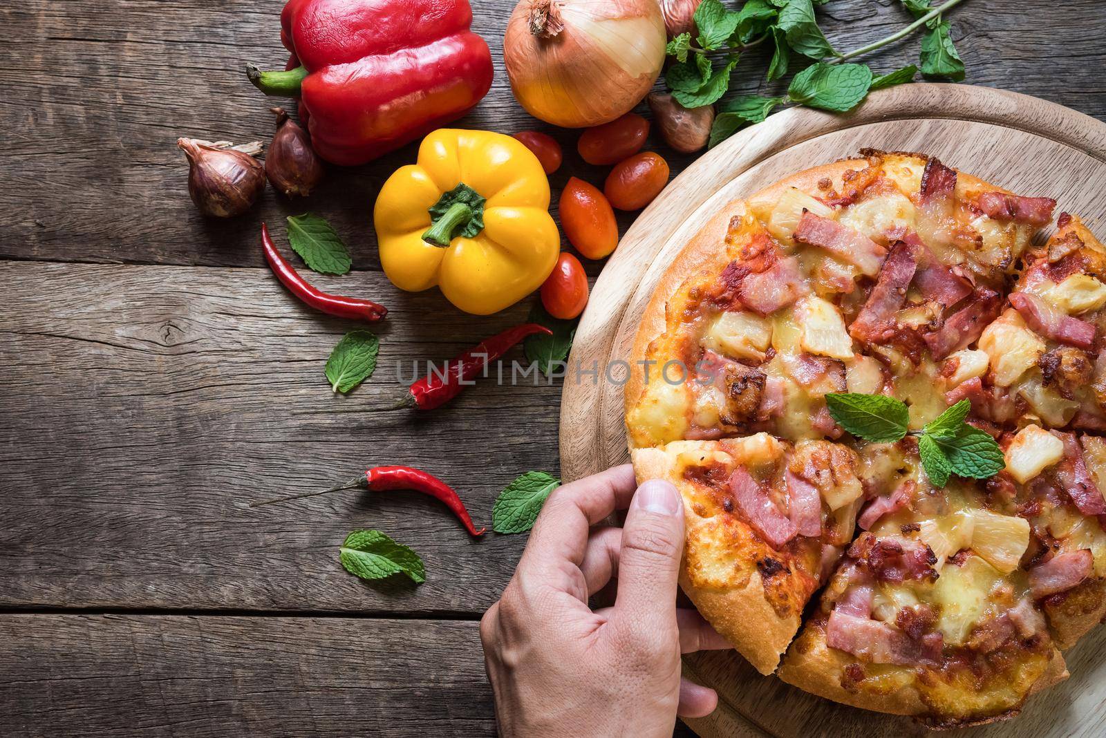 Delicious italian pizza on wooden table. Top view