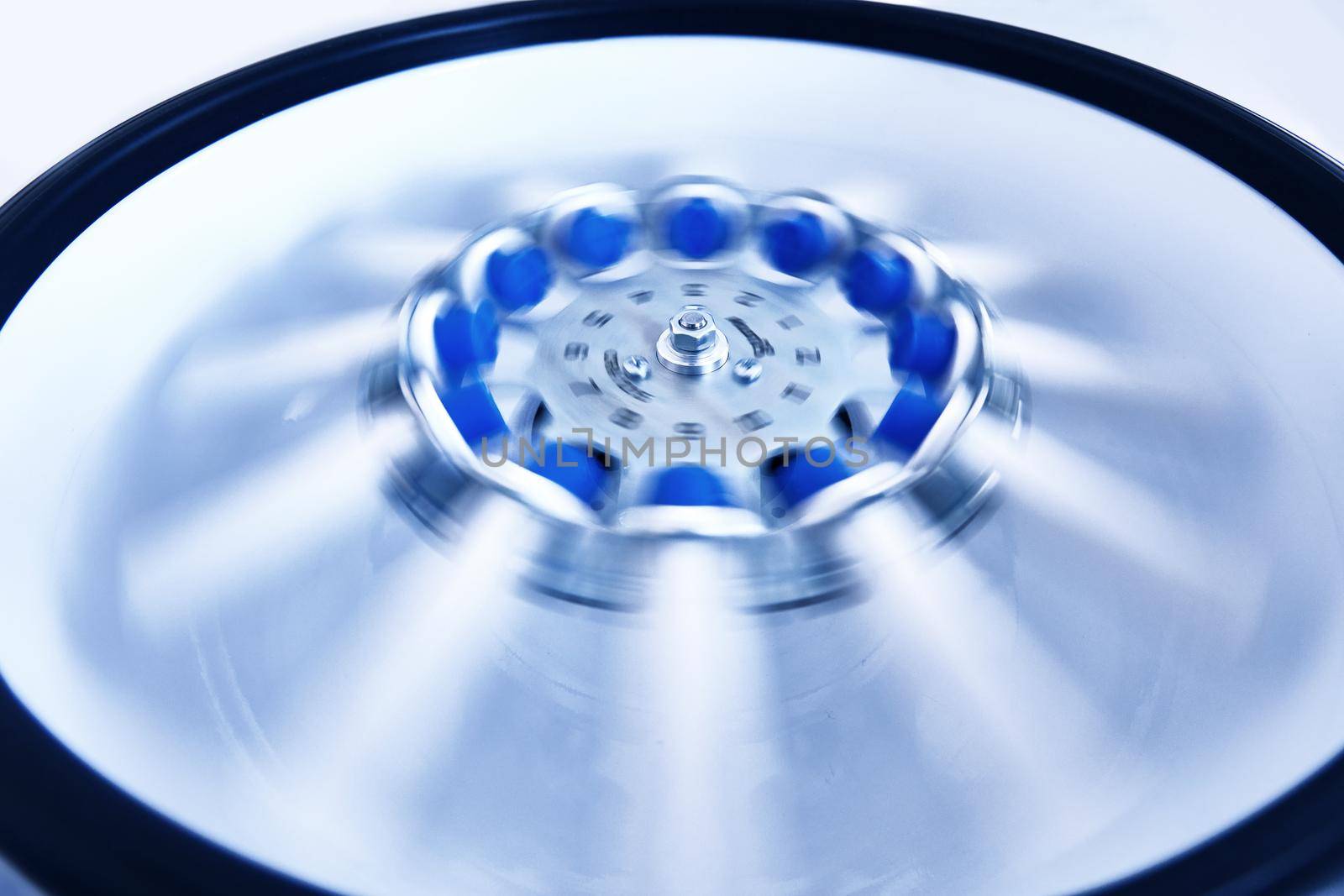 Blood test tubes in centrifuge. Plasma preparation in medical.