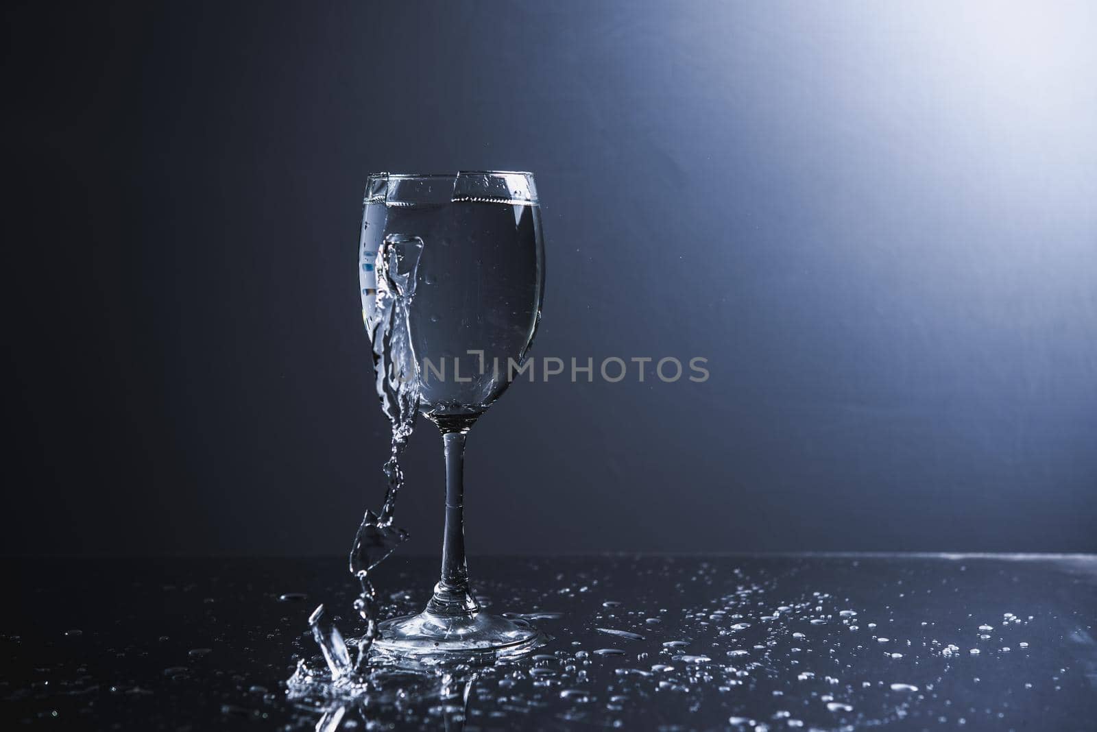 vine glass water broken on white backgeound isolated