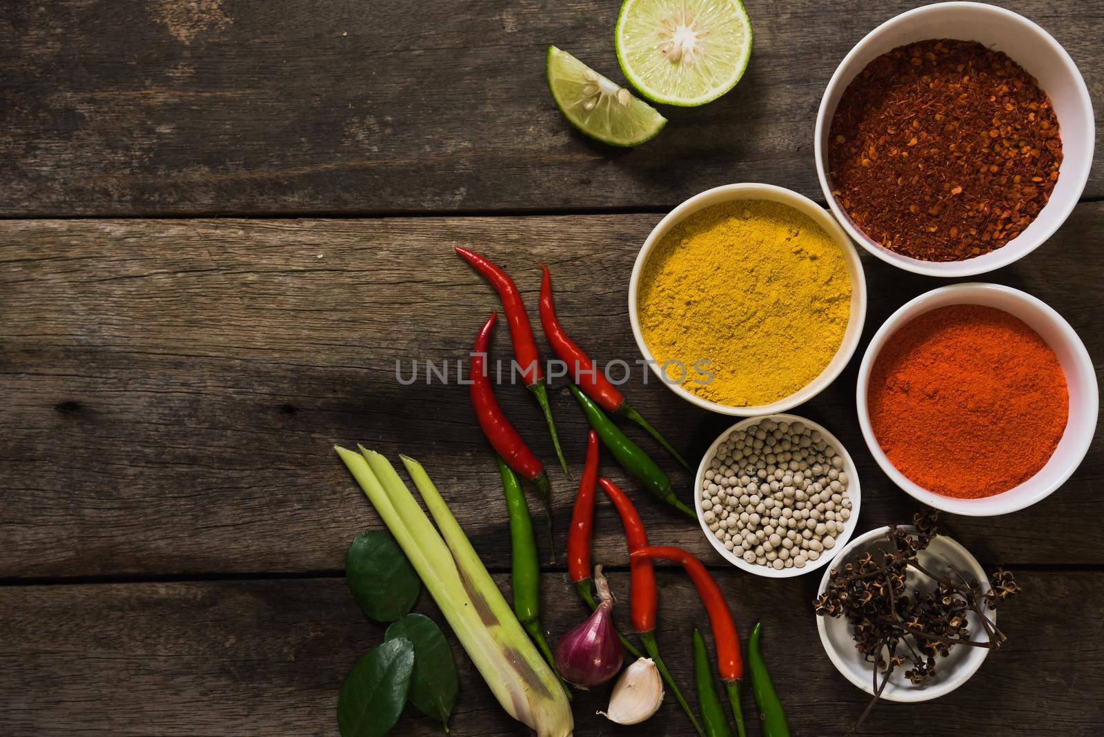 spices with ingredients on dark background. asian food, cooking concept by Wmpix