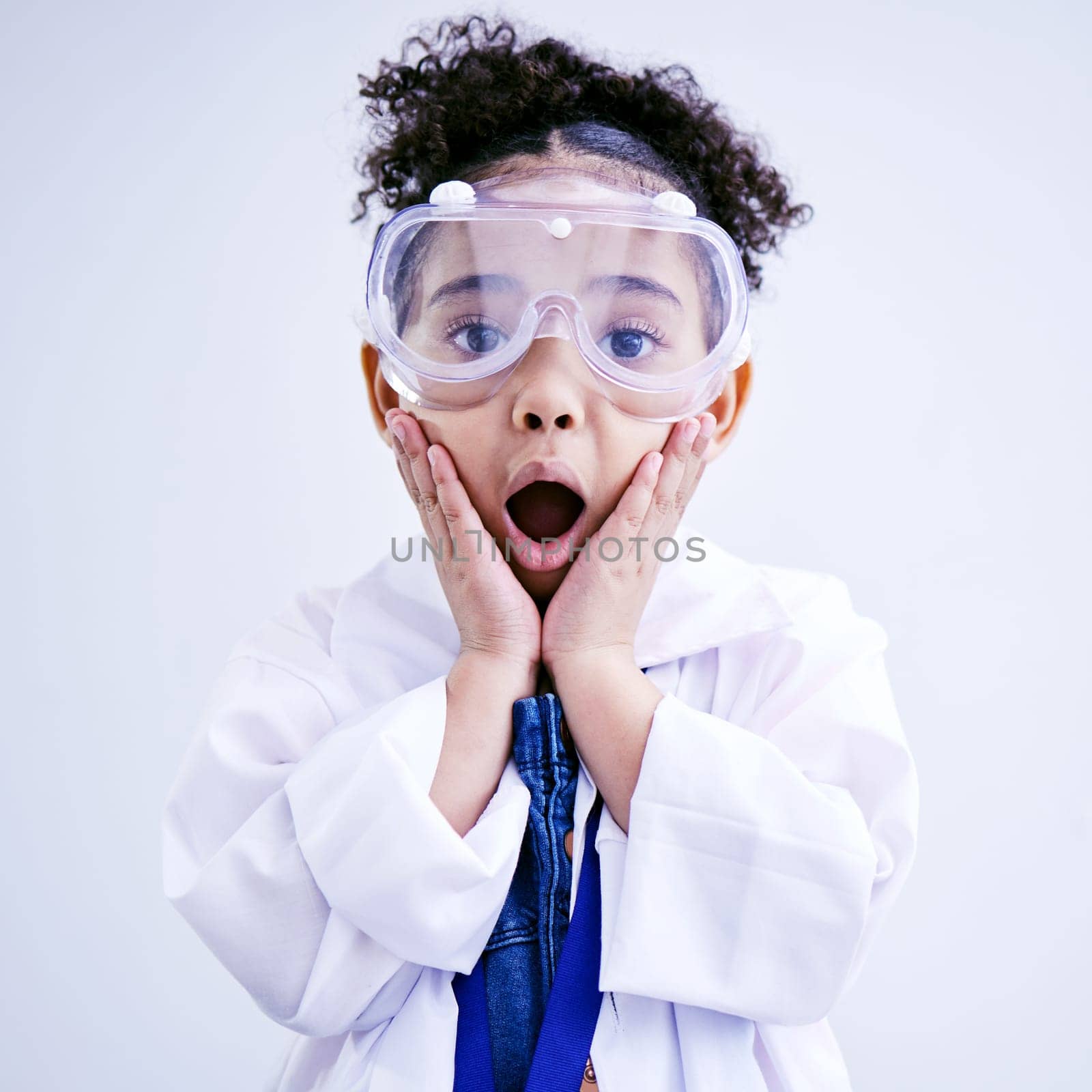 Child, shocked and science portrait with glasses in studio with open mouth, wow or surprised face. African kid student excited for education or biology experiment and learning for future scientist by YuriArcurs