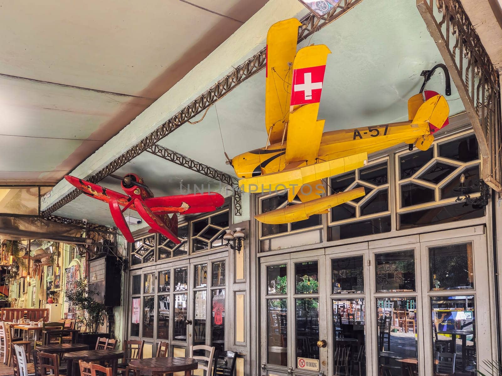 Day view of the empty traditional outdoor seating area of taverns with colorful chairs, tables and vintage decoration at the historic Bit Bazaar area.