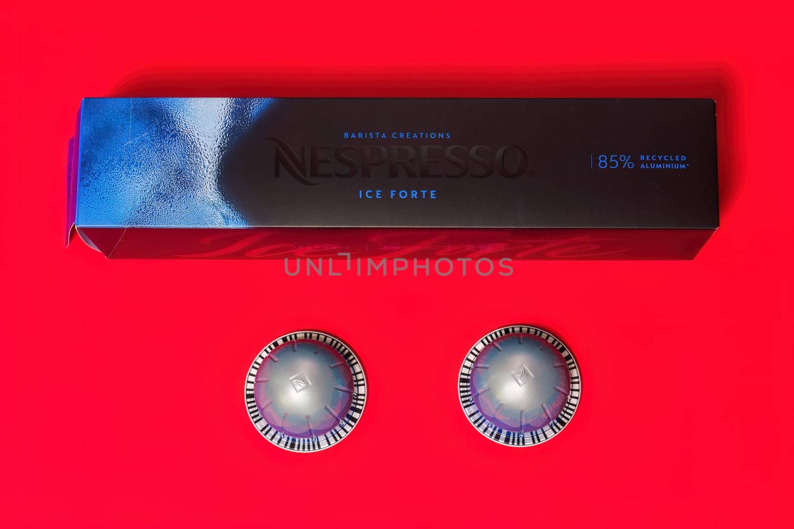 Nespresso Vertuo Pop machine Barista Creations Ice Forte aluminium pods with box and logo, used to create espresso-dripping coffee.