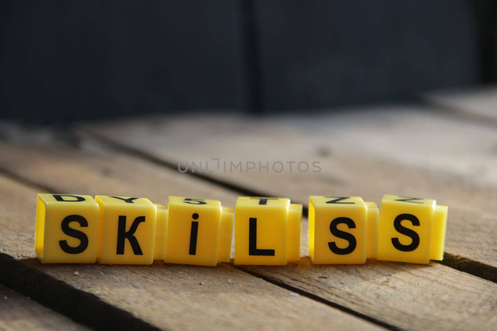 Skills. The inscription from the cubes on a vintage background. by Markgraf