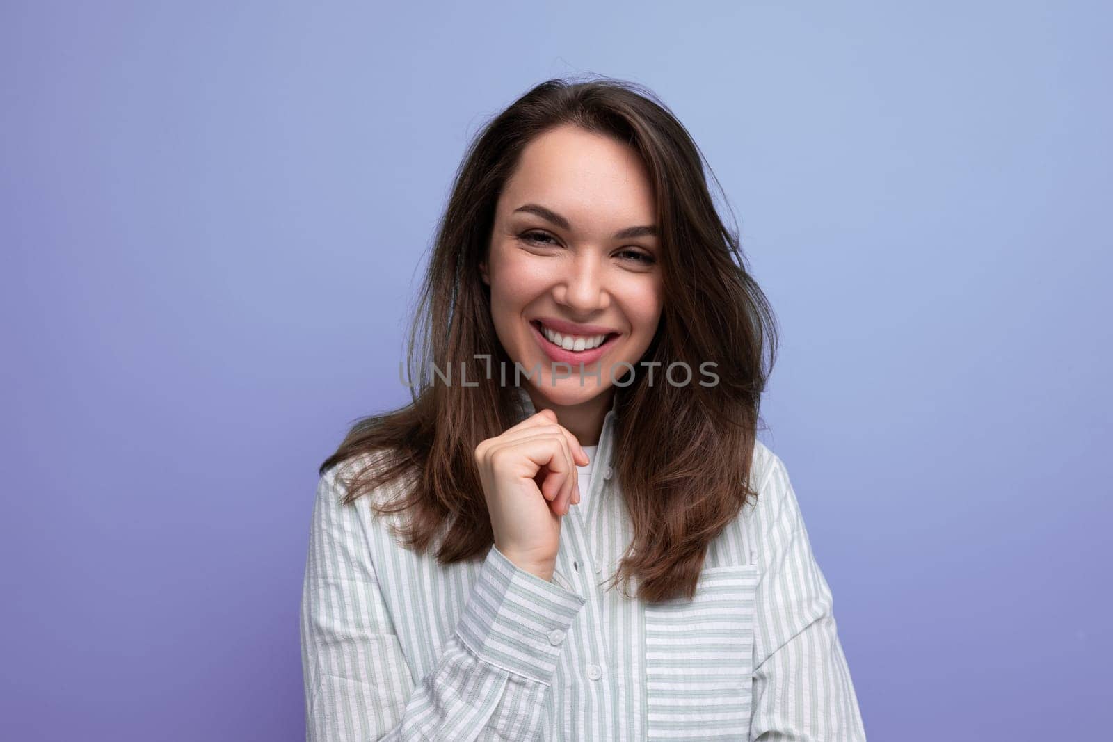 pretty young brunette lady with chic well-groomed thick hair.