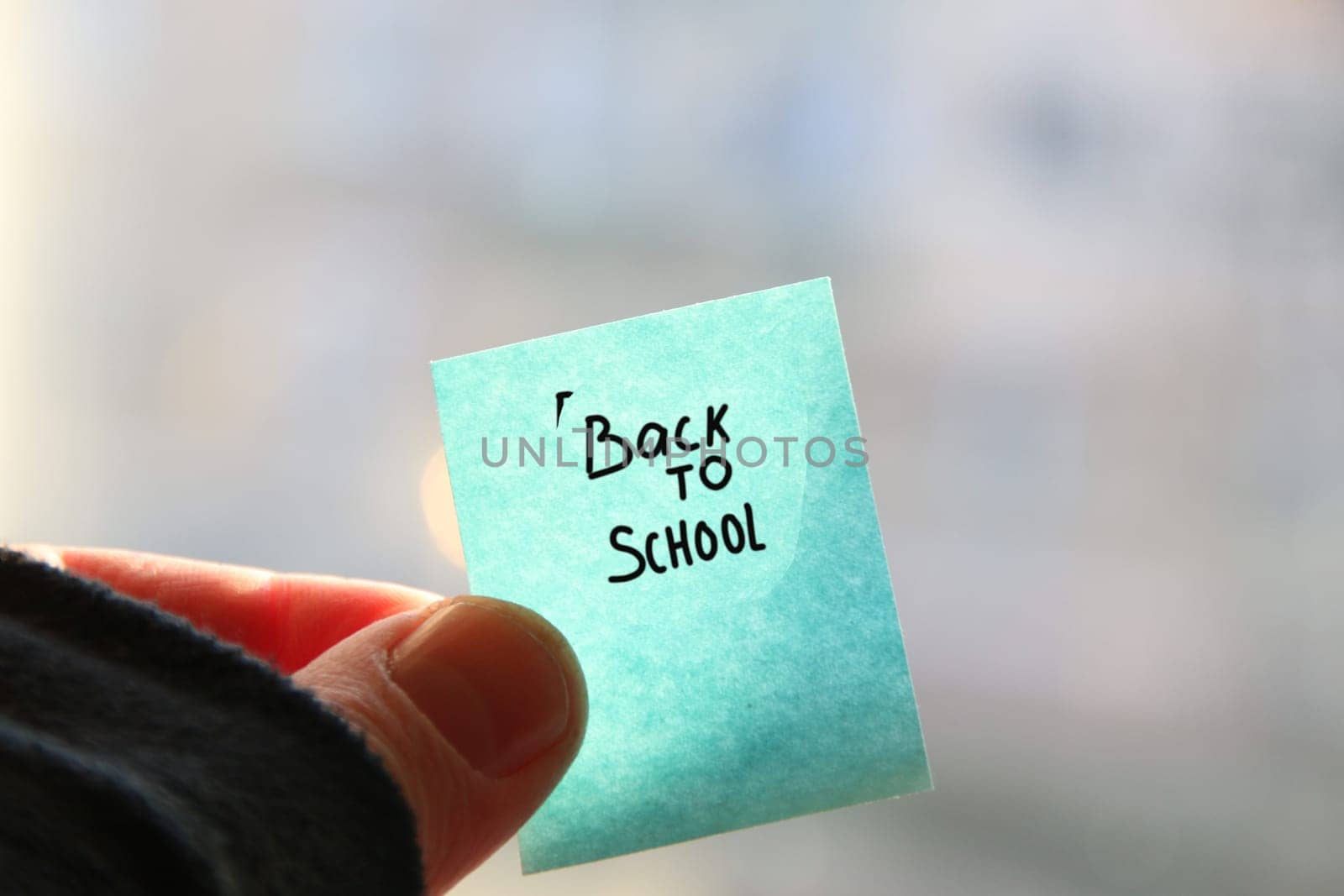 Back to School text on a paper tag. by Markgraf