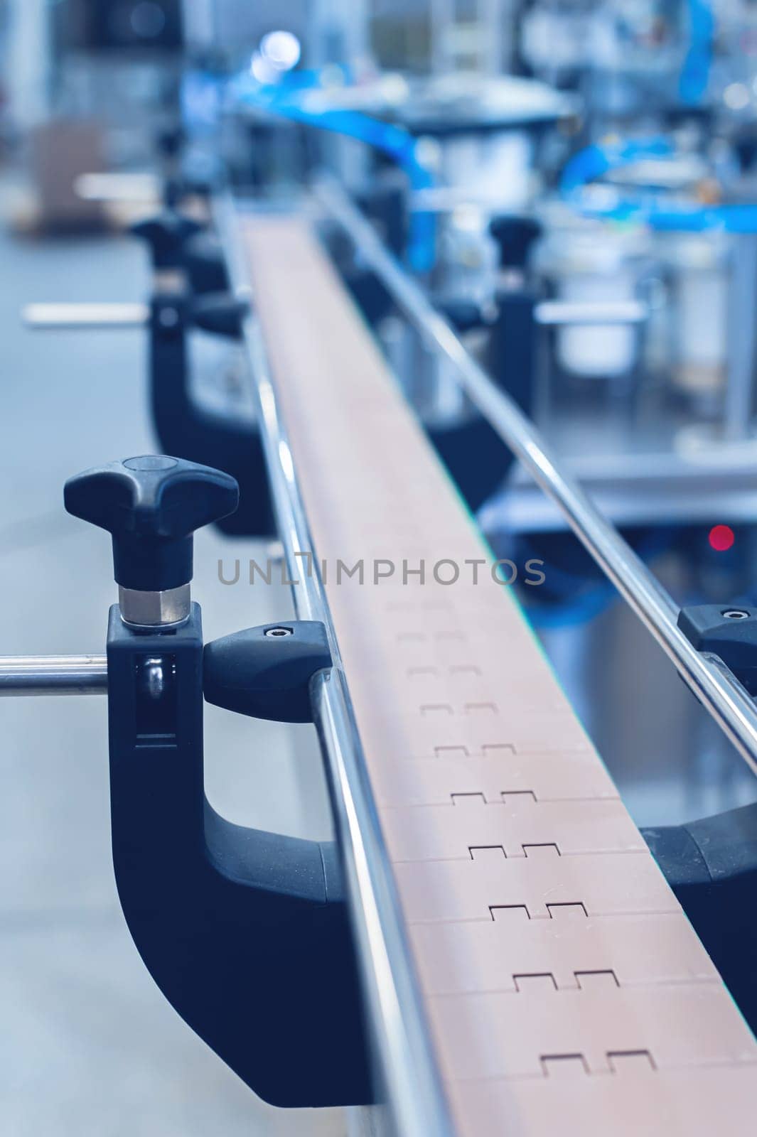 An empty production line conveyor belt at an equipment assembly plant. Toned image