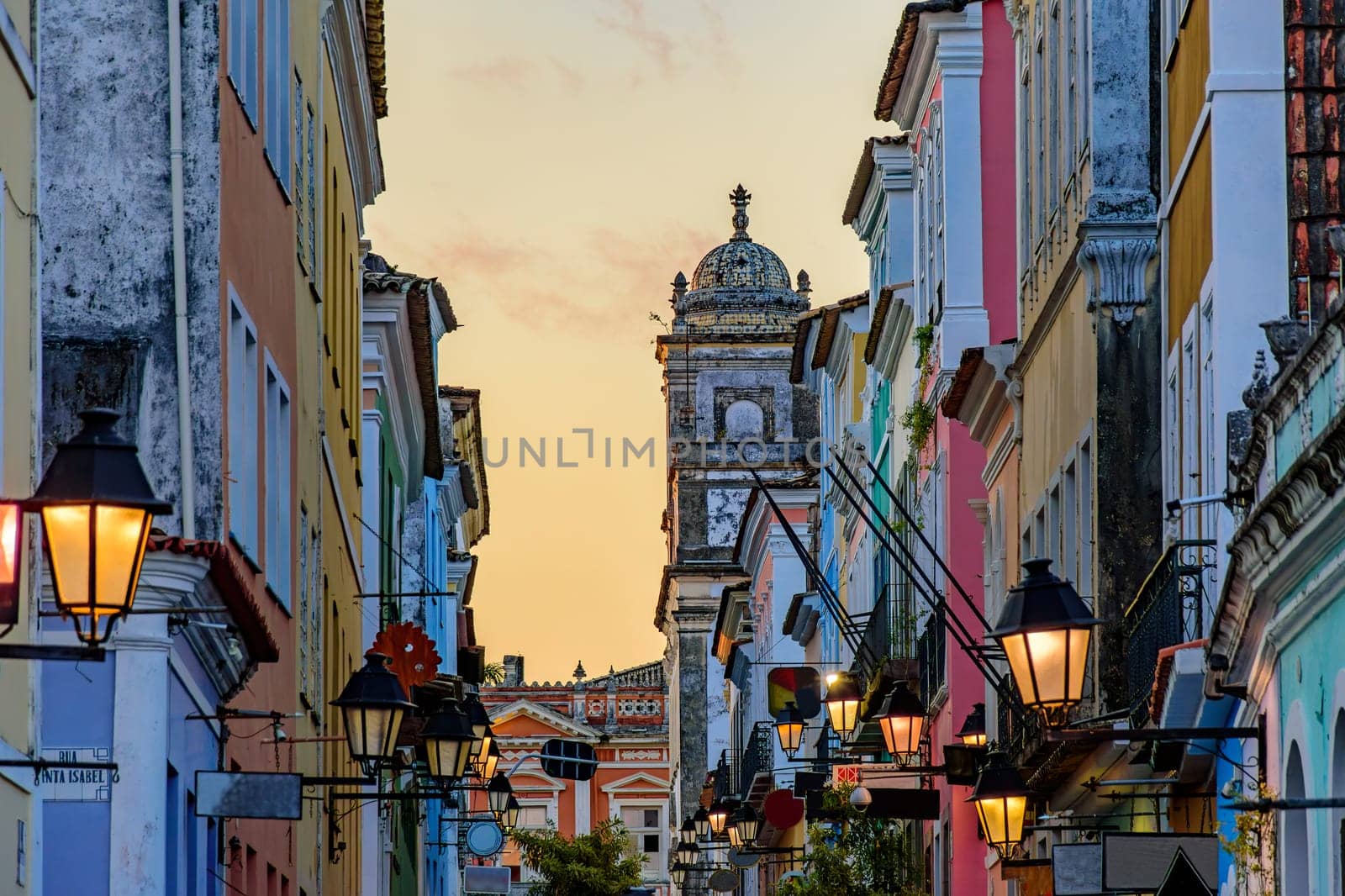 Street with historic houses with their facades and lanterns in the Pelourinho neighborhood in Salvador during sunset