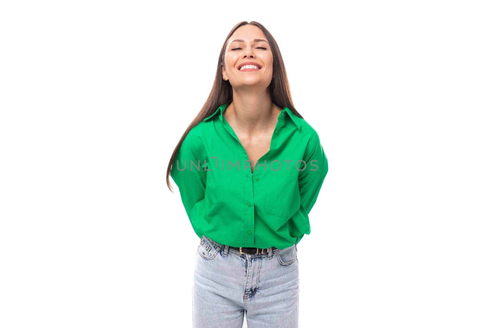 brown-eyed brunette young business lady in a green shirt on a white background with copy space.