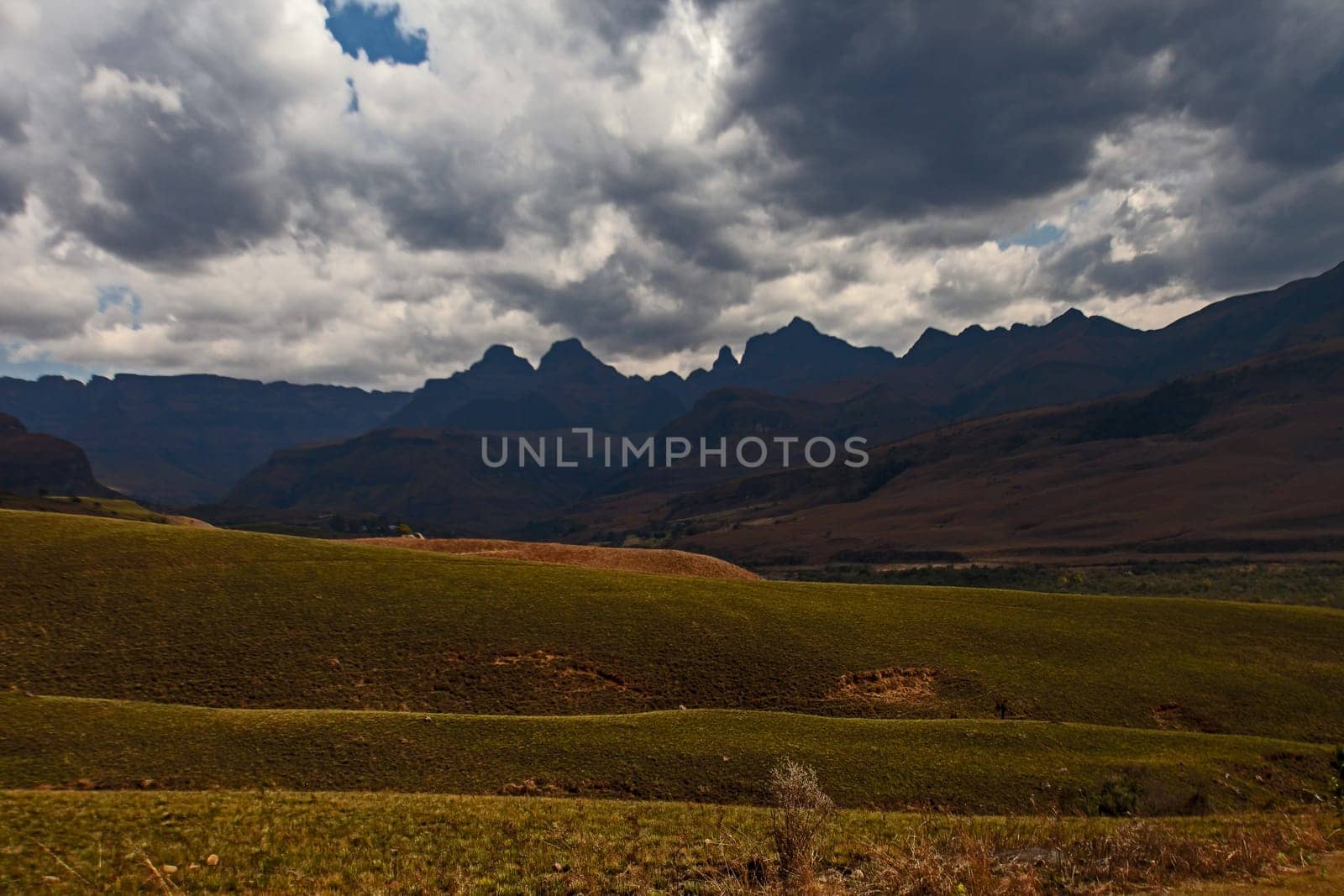 Storm clouds gather over Cathedral Peak. Drakensberg. South Africa