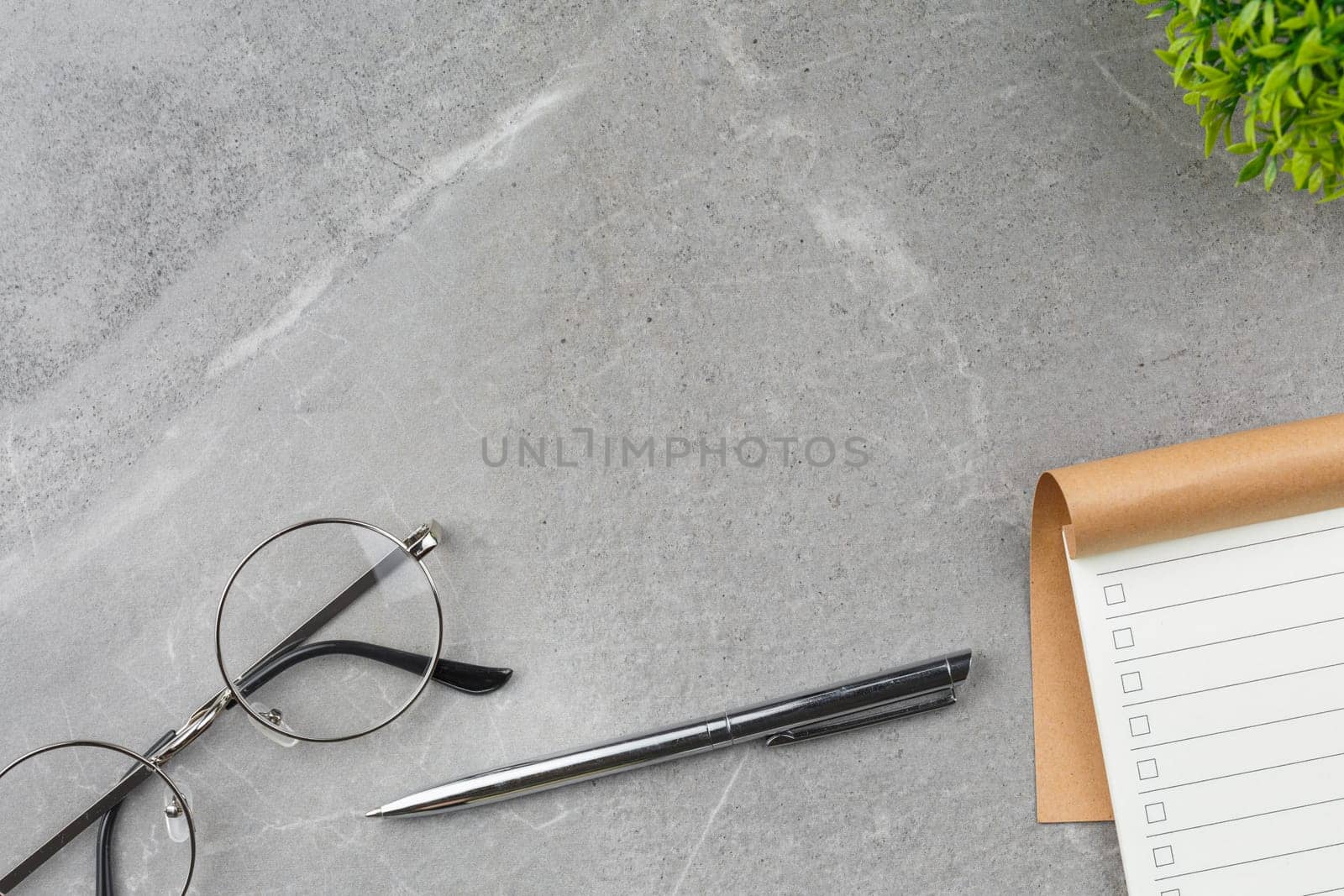 Open notebook on gray marble background. by alexxndr