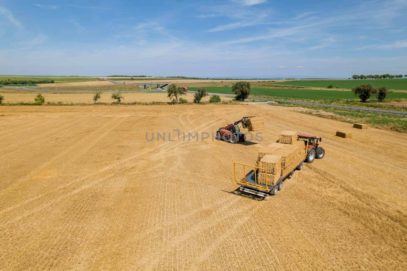 After the straw is gathered, it is taken to the barn for further processing.