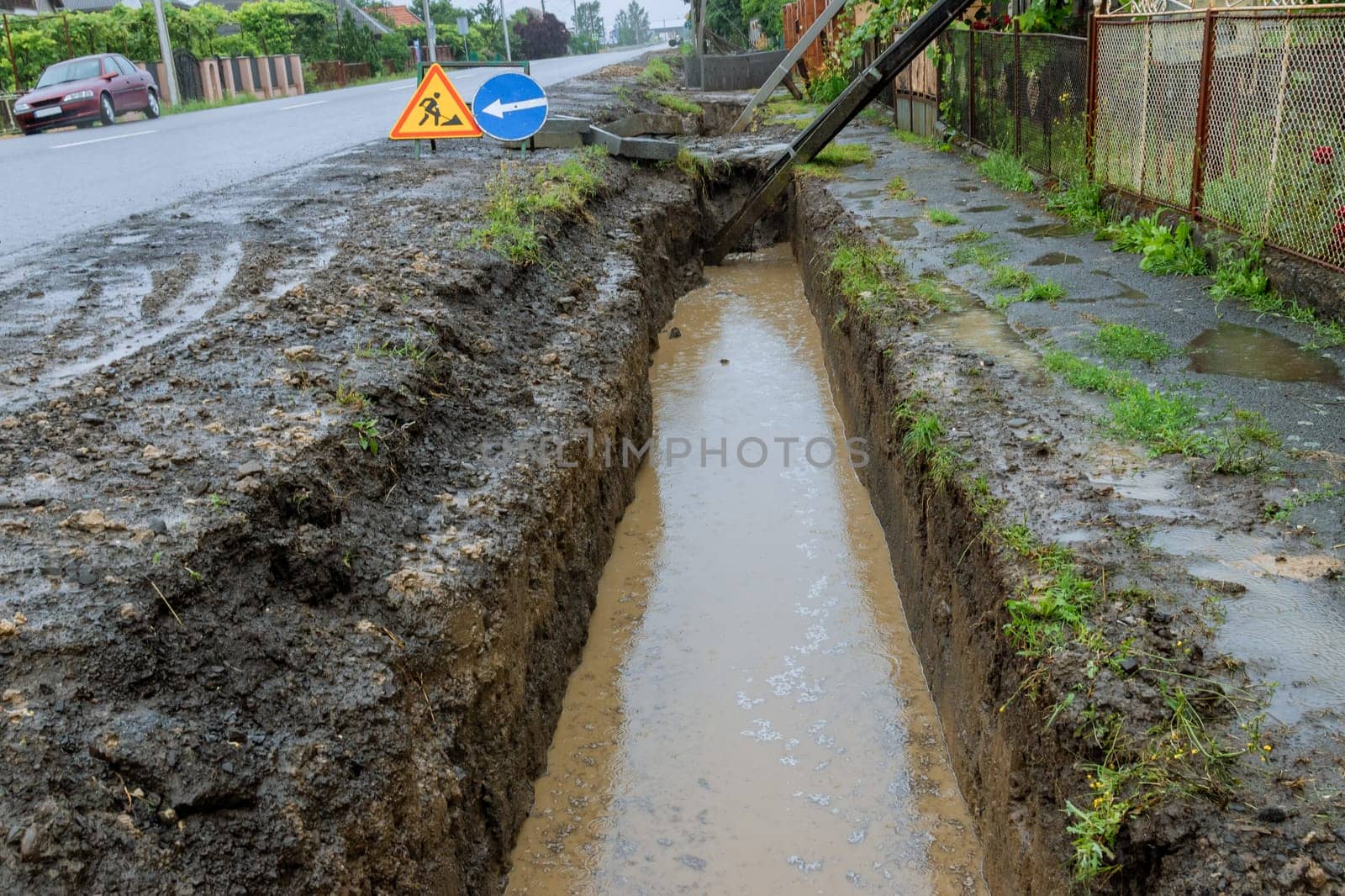 Heavy rainfall led to collapse of numerous electric poles, posing a threat to public safety. Recent heavy rainfalls resulted in fall of several electric poles in our neighborhood.