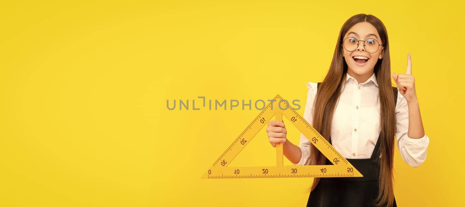 inspired with idea teen girl hold triangle. back to school. algebra and geometry. Portrait of schoolgirl student, studio banner header. School child face, copyspace. by RedFoxStudio