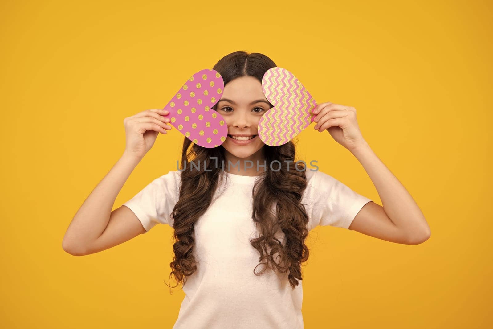 Valentines Day. Dreaming cute teen child with red heart. Happy teenager, positive and smiling emotions of teen girl. by RedFoxStudio