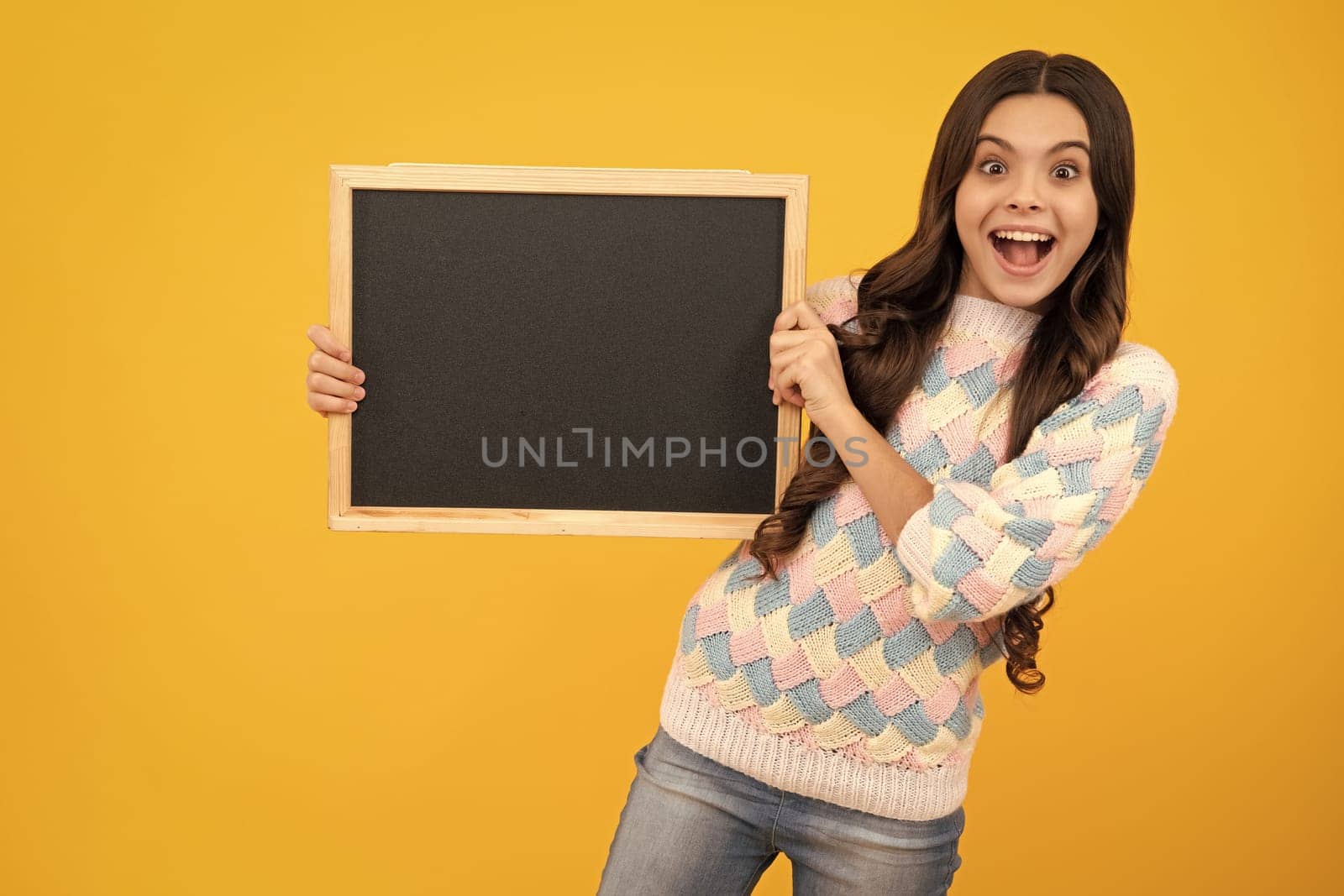 Little girl teen with blackboards. Teenager school girl hold blackboard for copy space, school sale