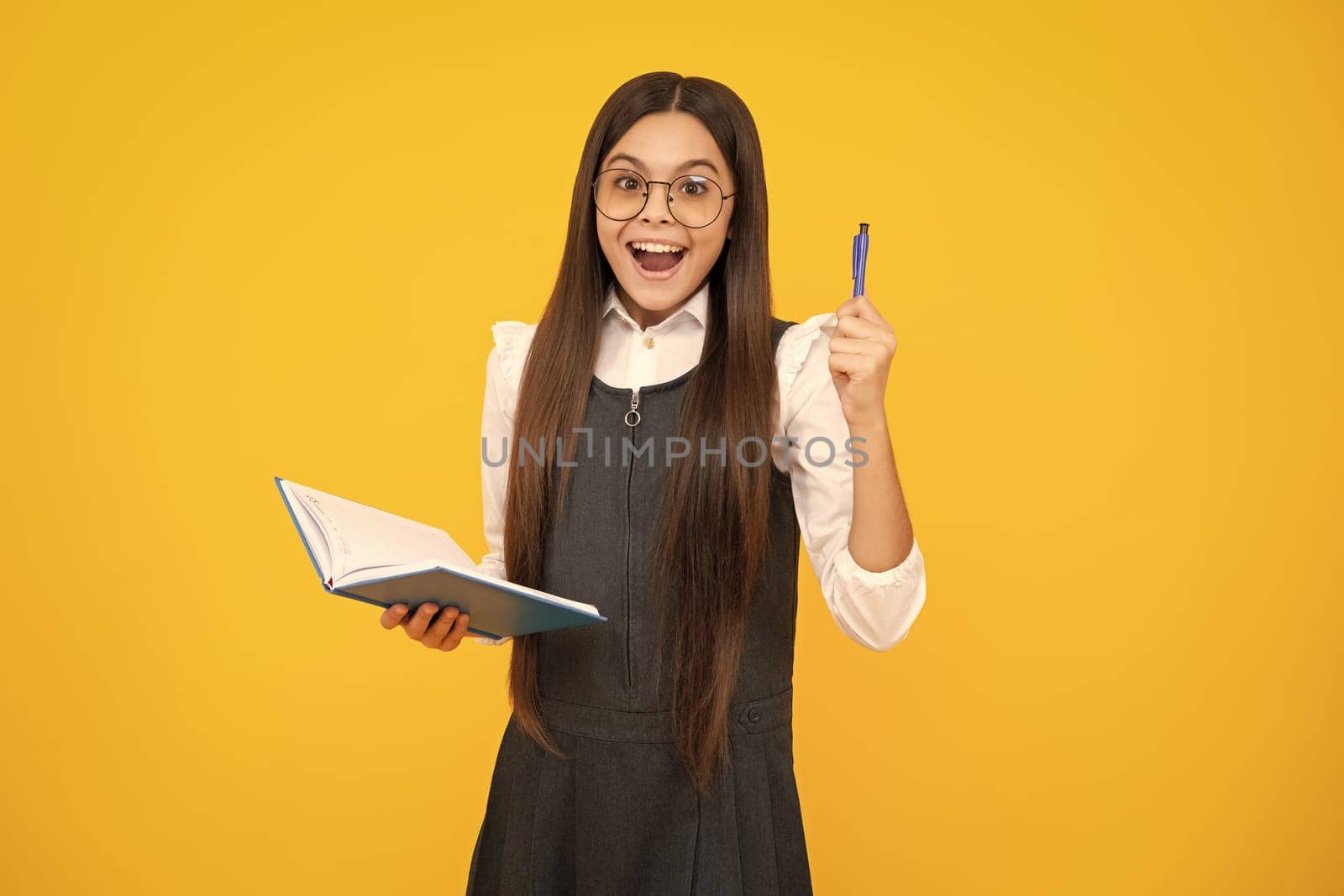 Teenager school girl with books isolated studio background. Surprised face, surprise emotions of teenager girl. by RedFoxStudio