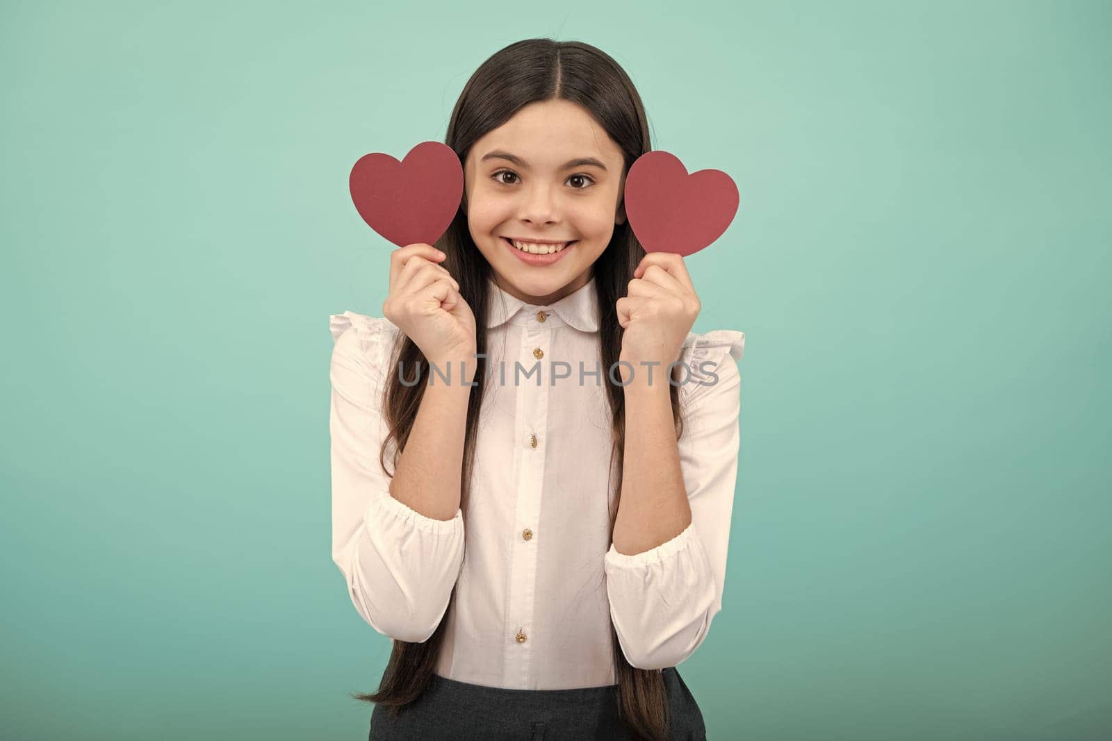 Valentines Day. Dreaming cute teen child with red heart