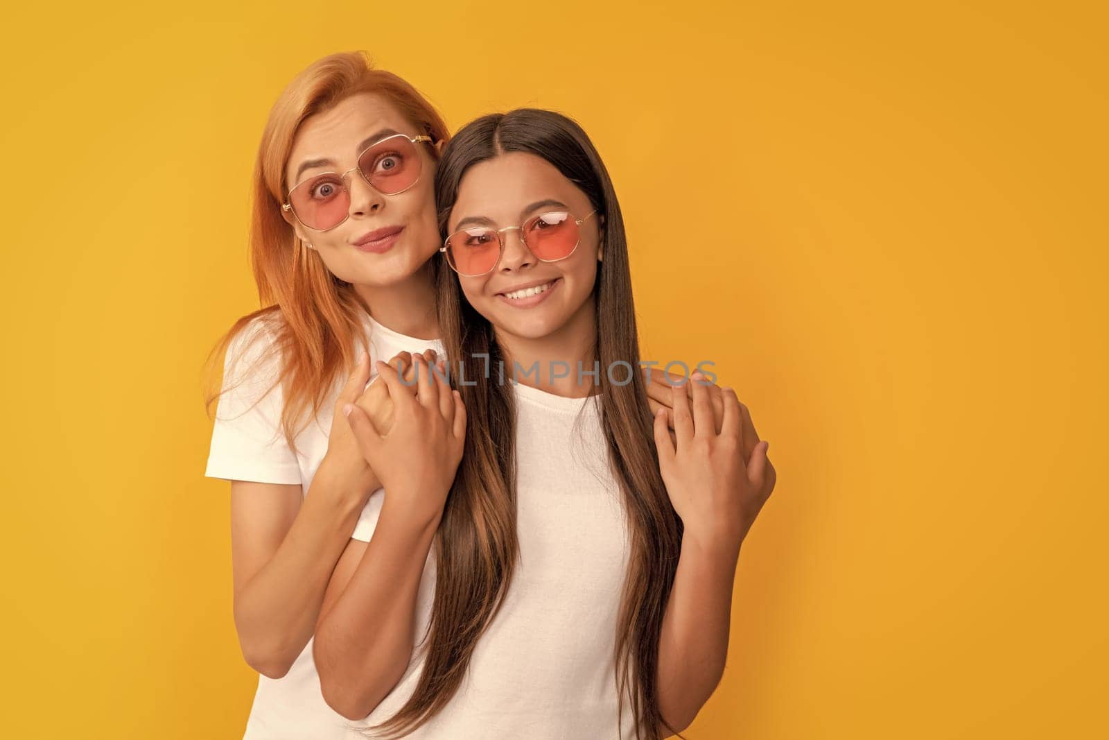 hugging kid and mom. mother and daughter in sunglasses. beauty and fashion. female fashion model. young girls in eyeglasses. portrait of happy child and mom. express positive emotions. friendship.